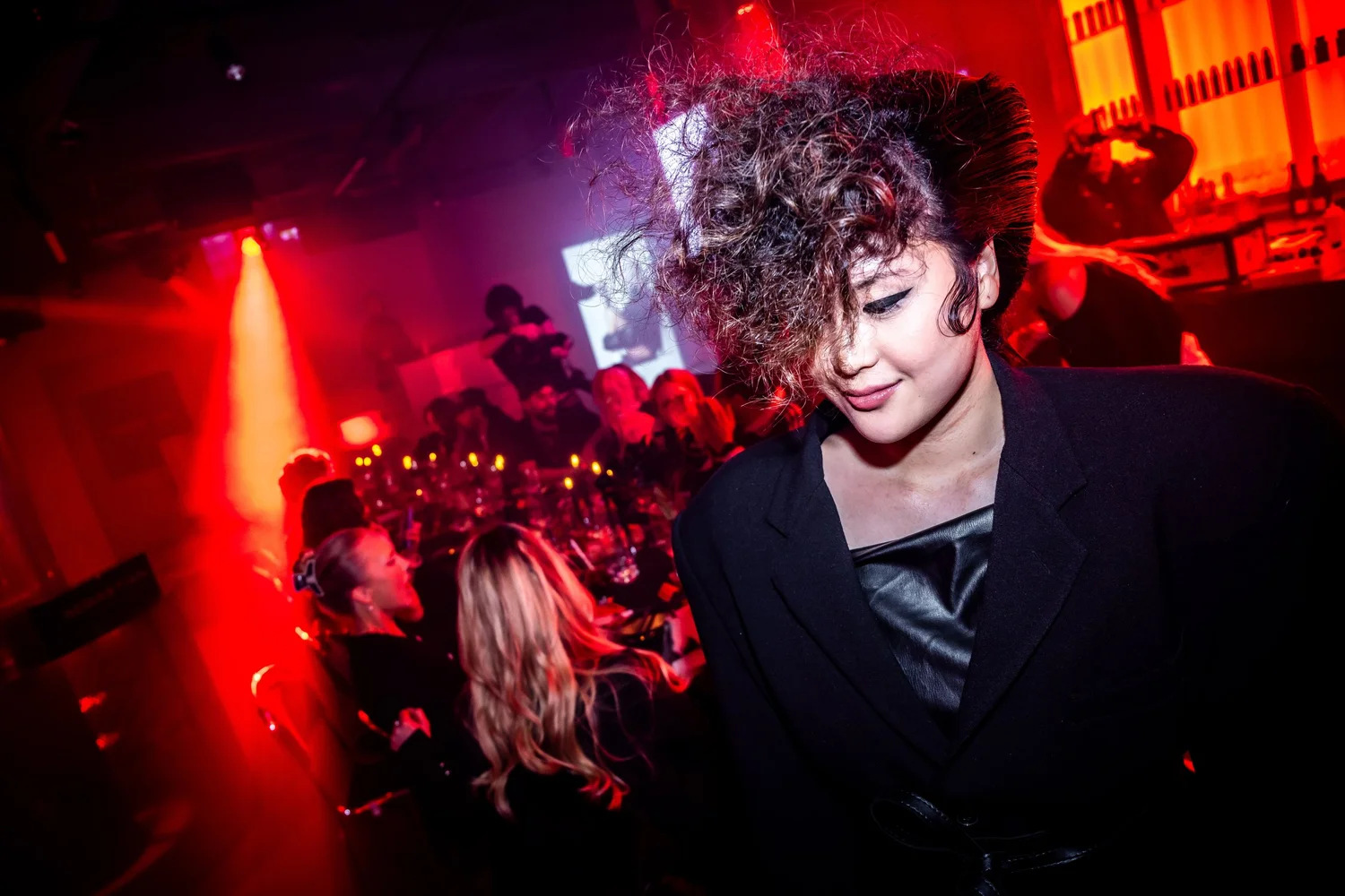 Guest with styled curly hair at the event
