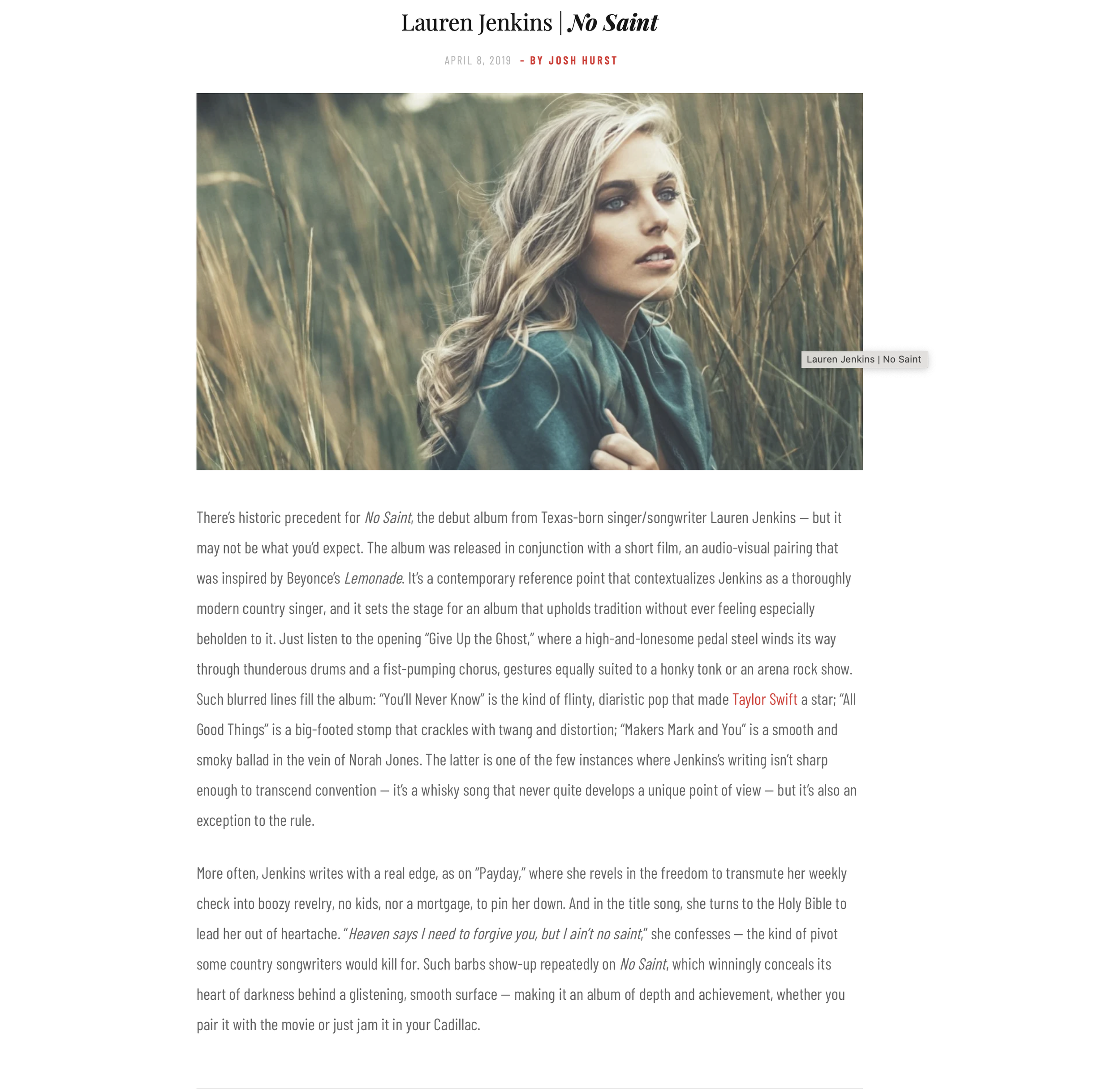 Lauren Jenkins with long blonde hair and blue eyes gazes thoughtfully to the side, sitting in a field of tall, golden grass.