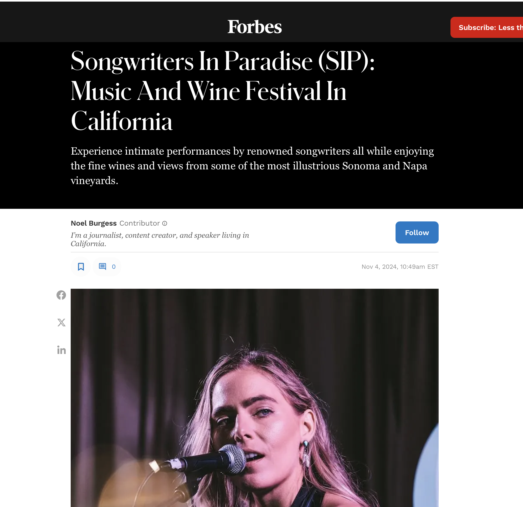 Lauren Jenkins with blonde hair singing into a microphone on stage at a music and wine festival.