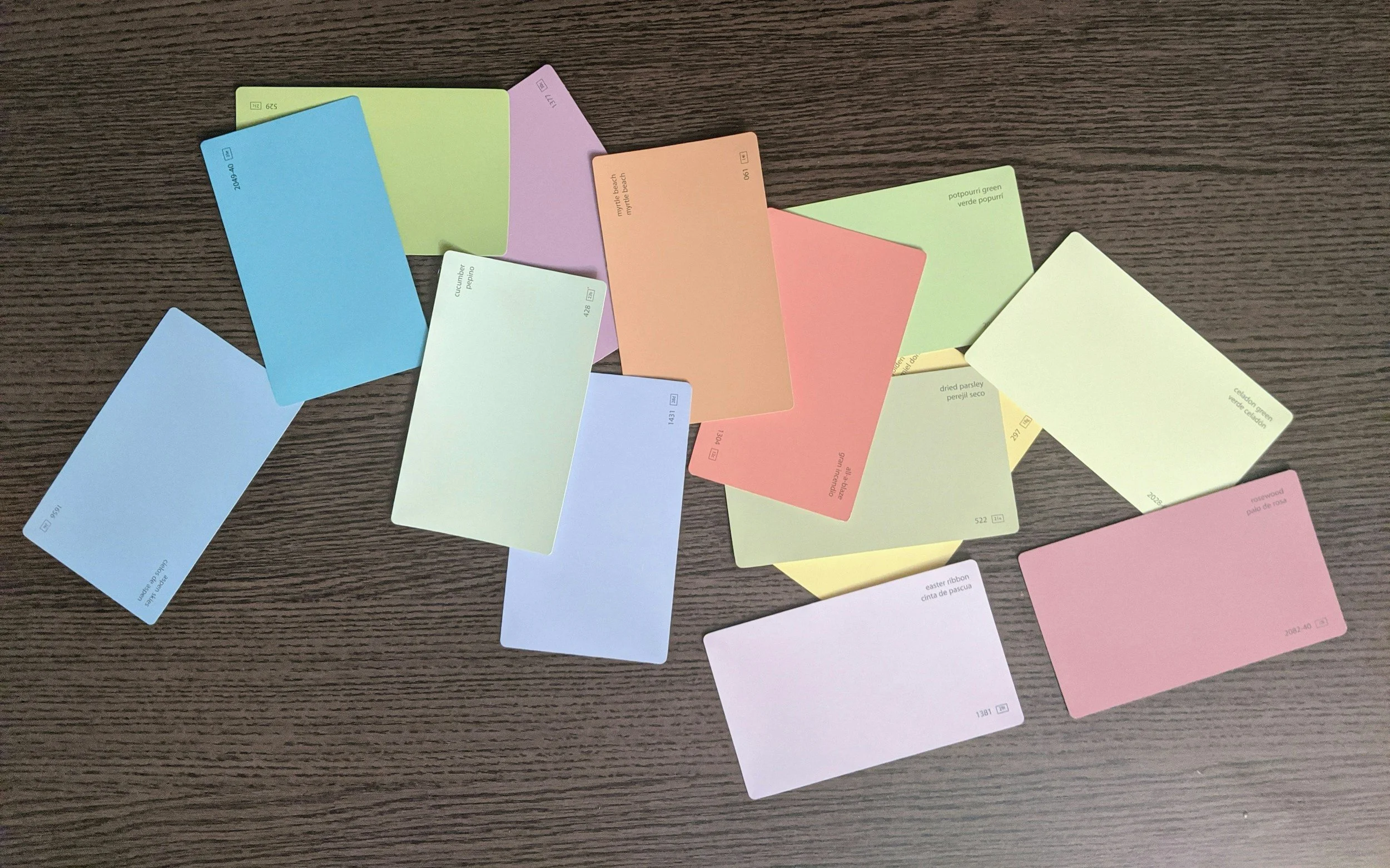 Assorted paint swatches on a wooden surface