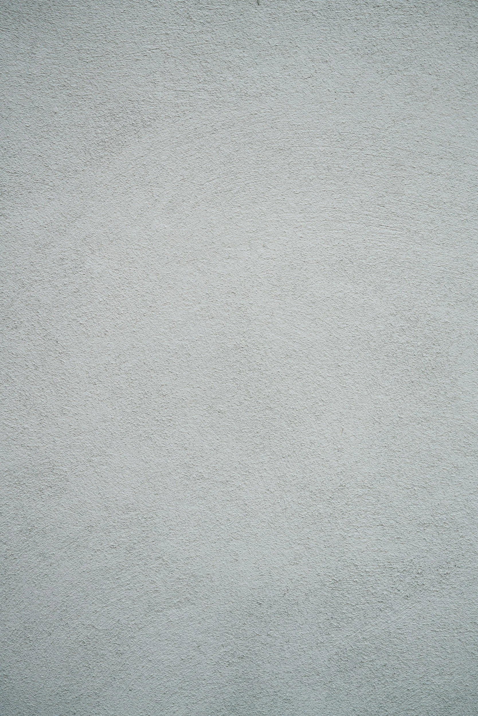 Close-up of a plain gray textured wall surface.