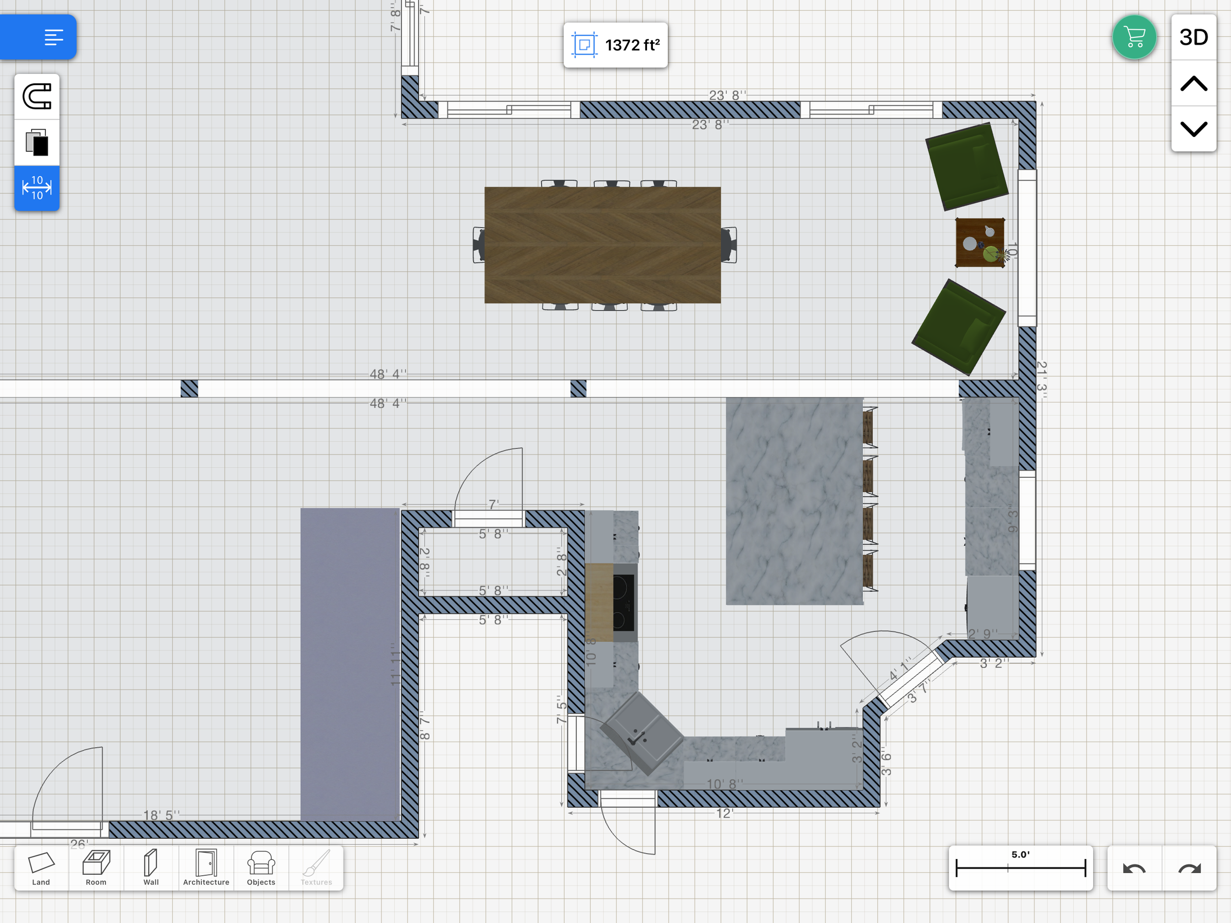 Floor plan layout featuring a kitchen with an island and bar stools, dining area with a rectangular table and chairs, and a seating area with two green chairs and a small table. Room dimensions and grid lines are visible.