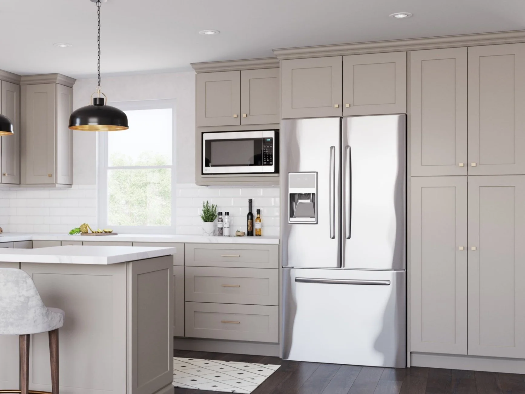 Modern kitchen with gray cabinets, stainless steel refrigerator, built-in microwave, and white countertops. Hanging black pendant lights and wood floors.