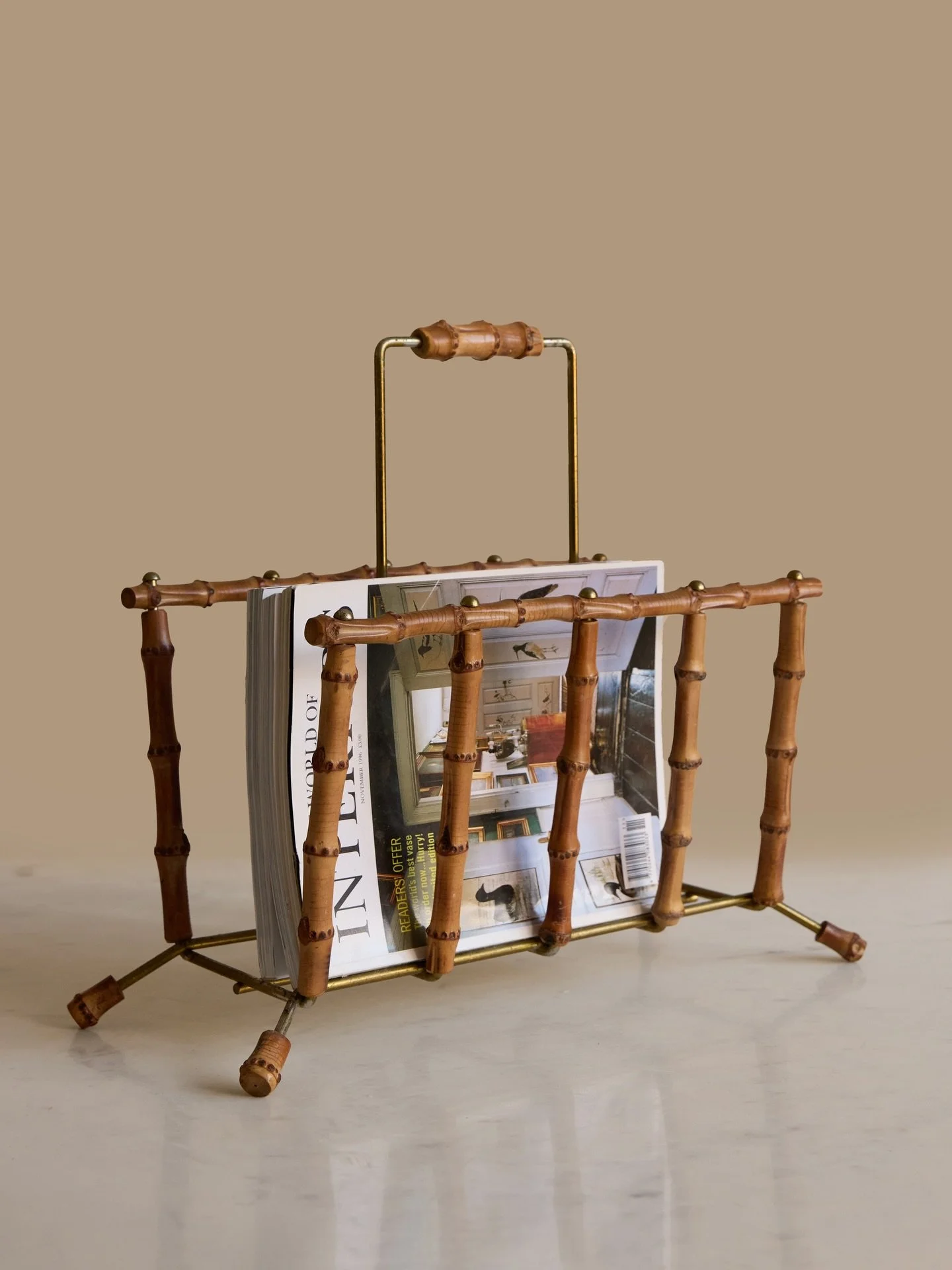 Available | An incredibly cool French 1960&rsquo;s bamboo and gold metal magazine rack. Obsessed with this one, particularly love its coordinating bamboo feet, could see this looking right at home beside an armchair or in a bathroom too! Link in our 