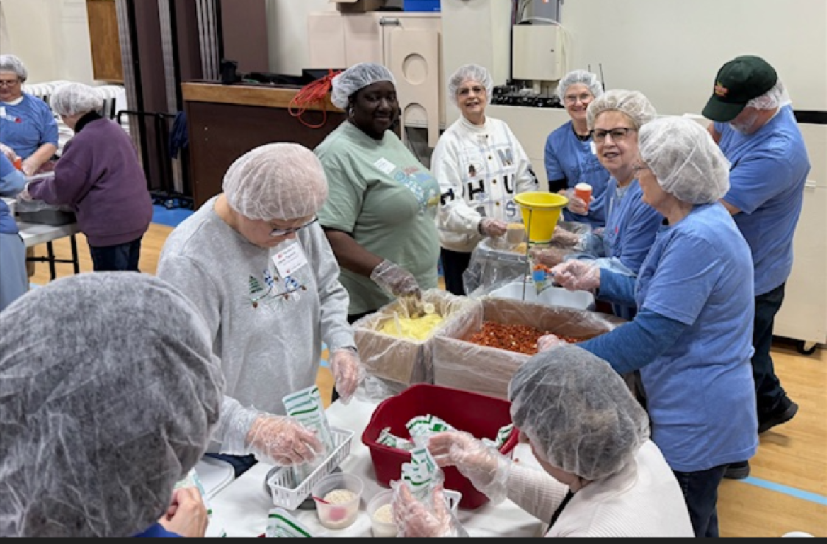 Volunteers pack meals for people of Ukraine