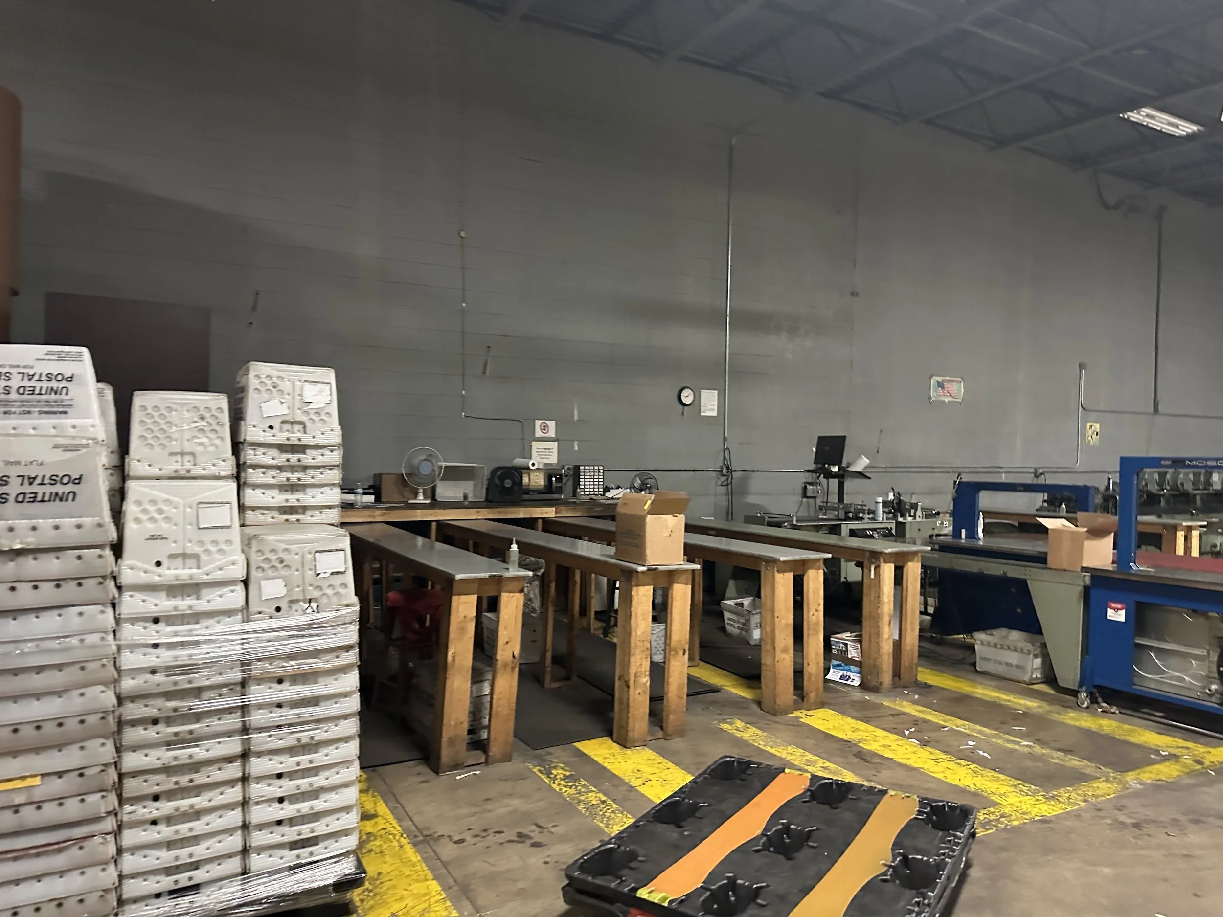 This is the area where inserts are put into the paper. To the left are just a few of the stacks of Post Office boxes used to organize shipments