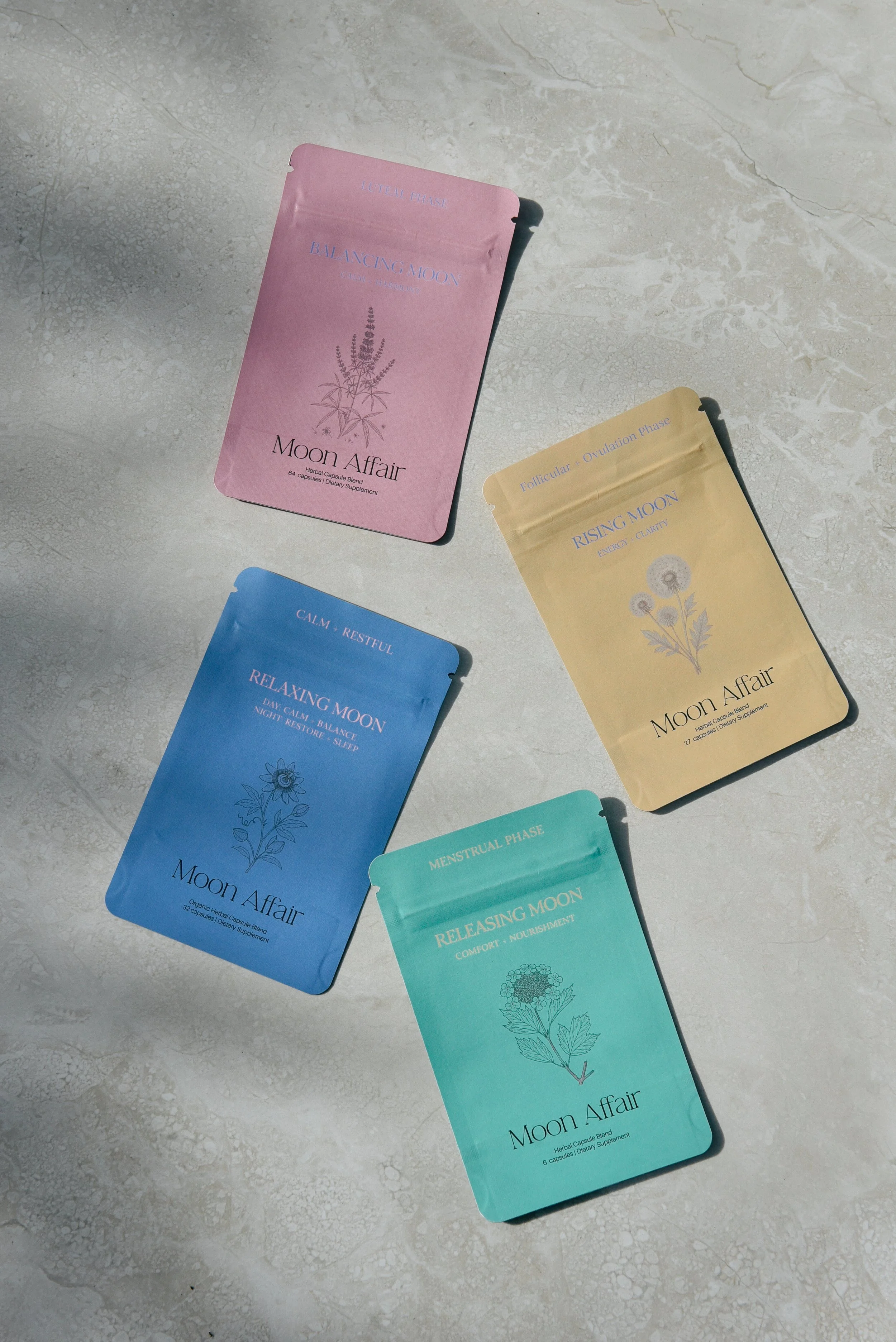 Moon Affair 4- phases pouches.  such as Lunar Phase, Ovulation Phase, Menstrual Phase, and Releasing Moon, with pastel colors and botanical illustrations.