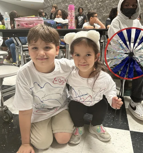 Two students smiling at a school event