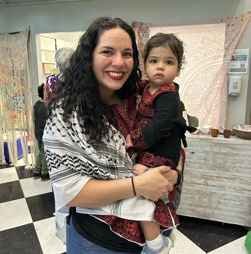 Mother and child in traditional embroidered clothing