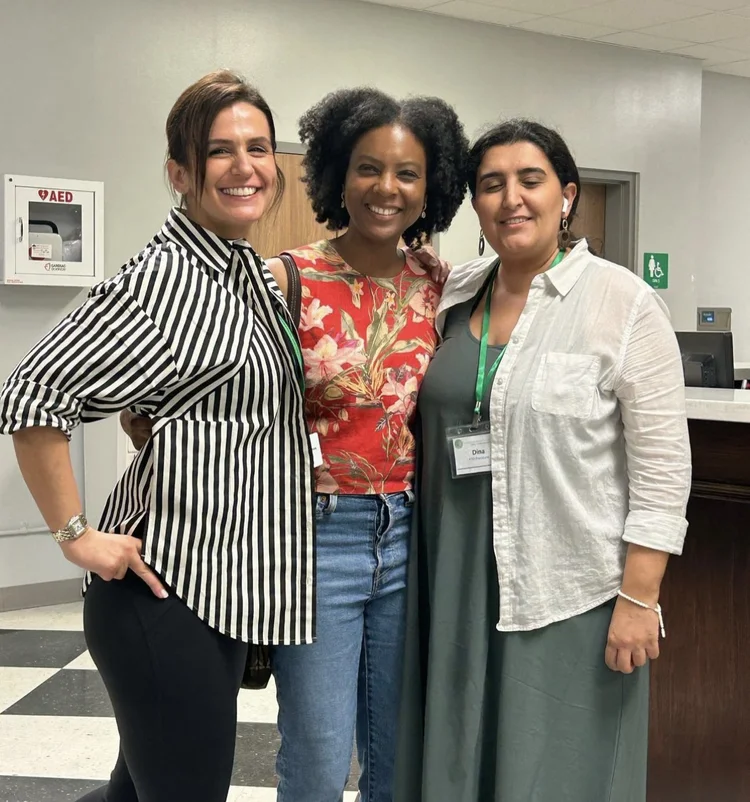 Three parents smiling together