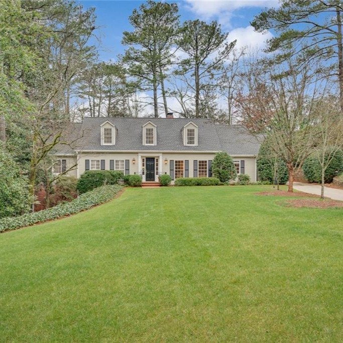Tucked behind mature landscaping and a perfectly level lawn, this charming Cape Cod offers that rare blend of warmth, character, and timeless style. Inside, natural light fills the fireside family room, where a wall of windows opens to a private blue