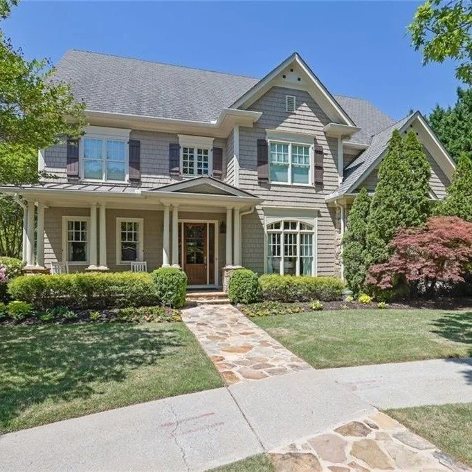 Set behind the gates of Brookhaven Lakes, this John Willis classic has a cul-de-sac location, cedar shake and stone exterior, a color-drenched blue office, gracious entertaining spaces, a screened porch overlooking a level backyard, and a terrace lev