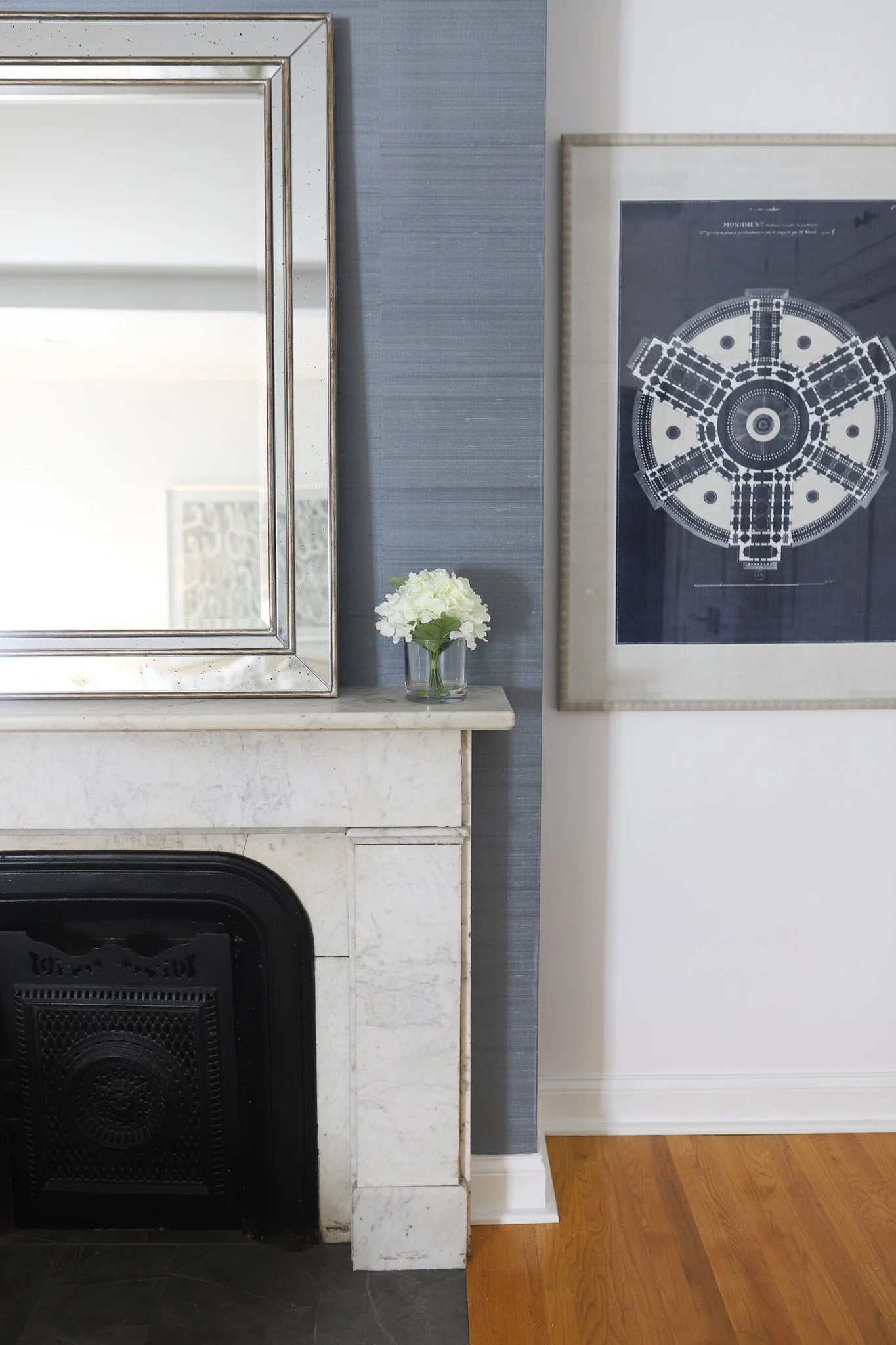 Fireplace space showcasing the vibrant power of wallpaper - adding warmth through patterns and textures