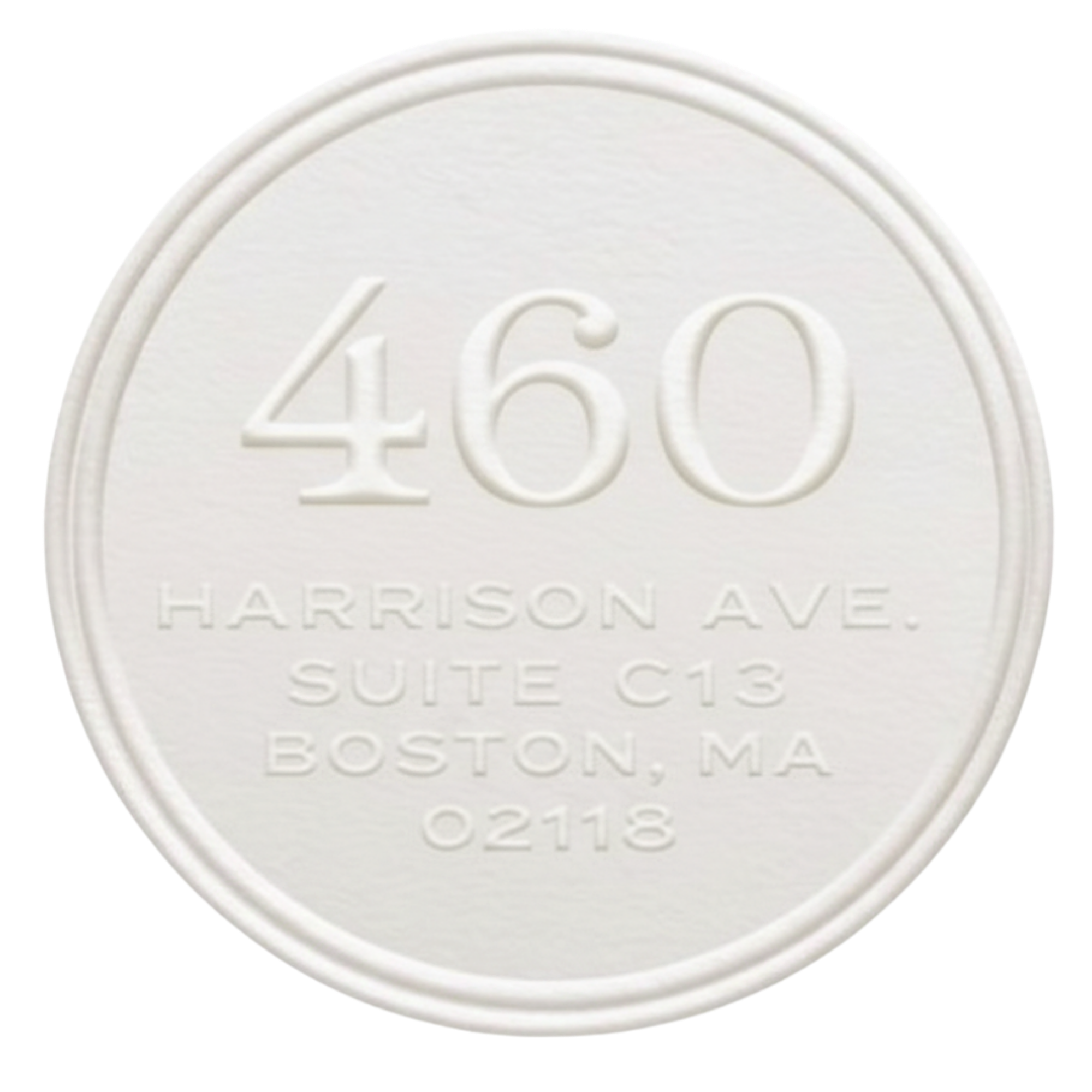 A white mint tablet with the text '260' and other smaller, blurred text, including 'HARRISON AVE.' and 'BOSTON, MA' embossed on it.