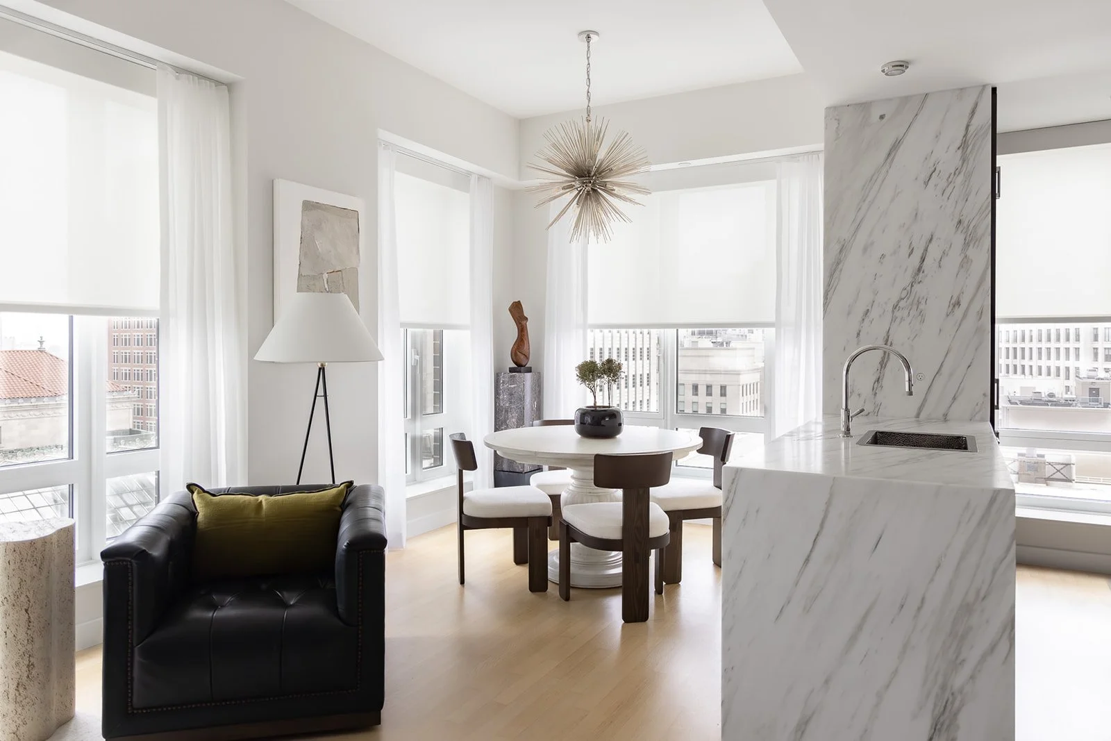 Open space dining room and kitchen in Boston's Back Bay, showcasing rich, tactile materiality that invites a slower, more intentional pace