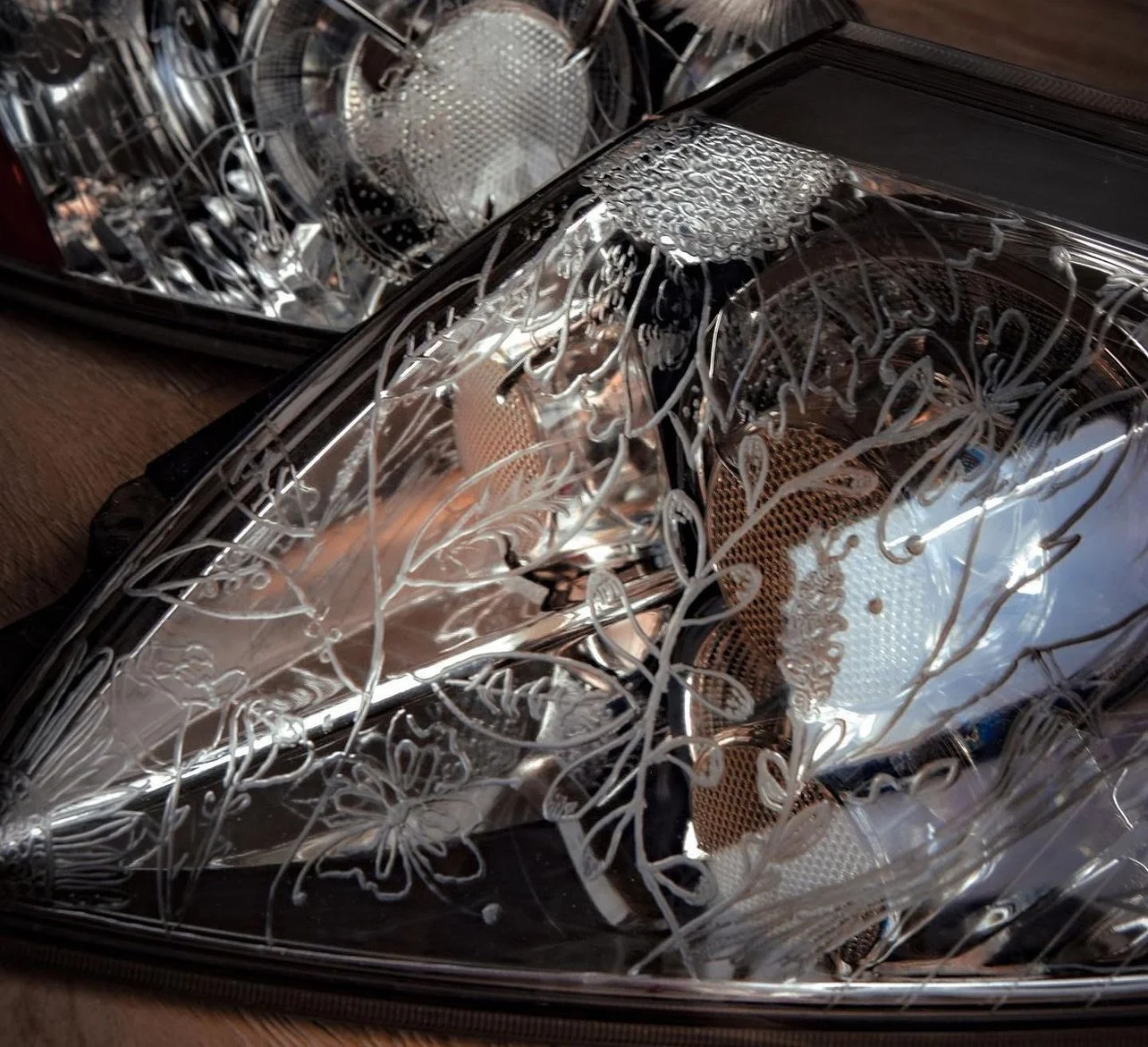 Engraved floral design on Mitsubishi tail lights