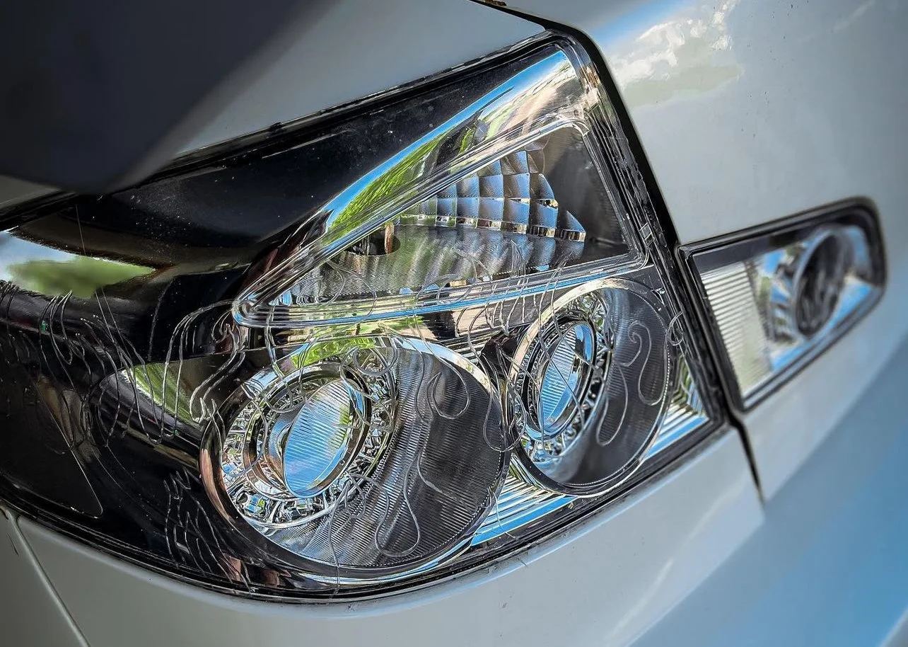 Engraved flame design on aftermarket Infiniti tail lights