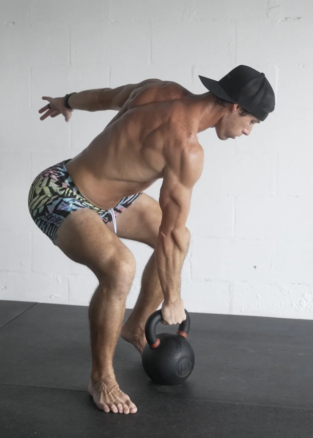 Adam Gooch coaching a single-arm kettlebell movement