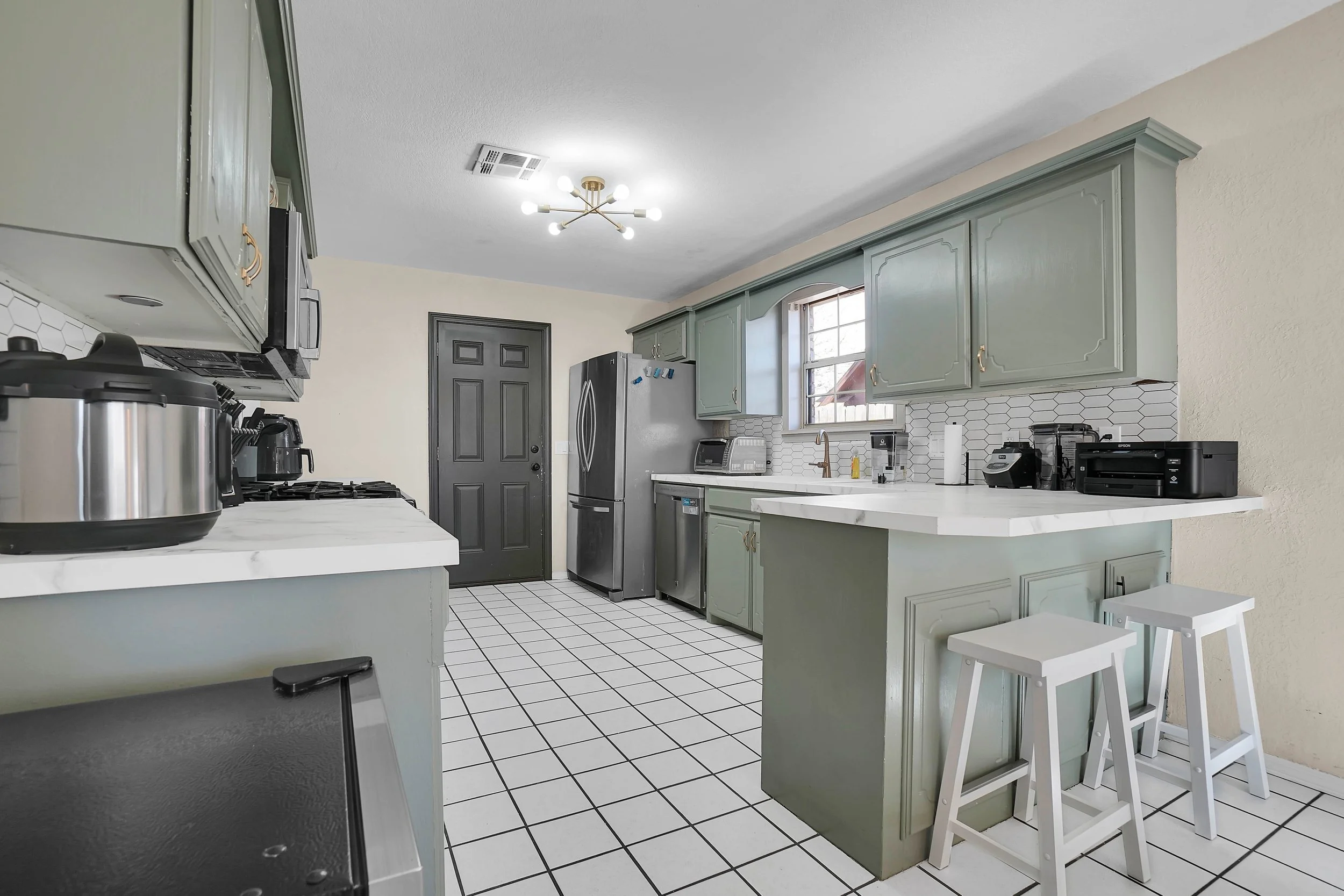 Breakfast bar in a stocked kitchen