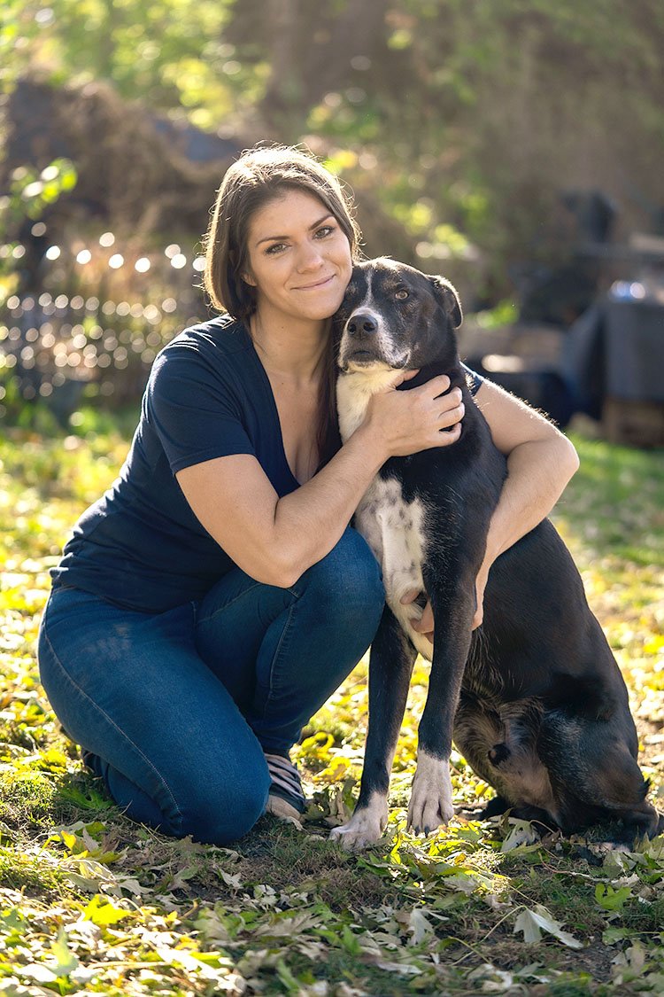 Andrea with her dog JJ at their dog training facility