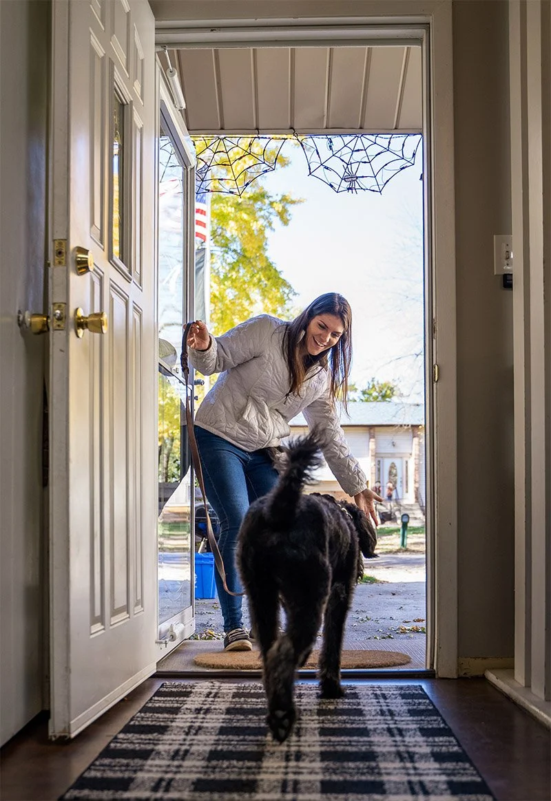 Dog trainer focuses on balance dog training, obedience commands and door manners