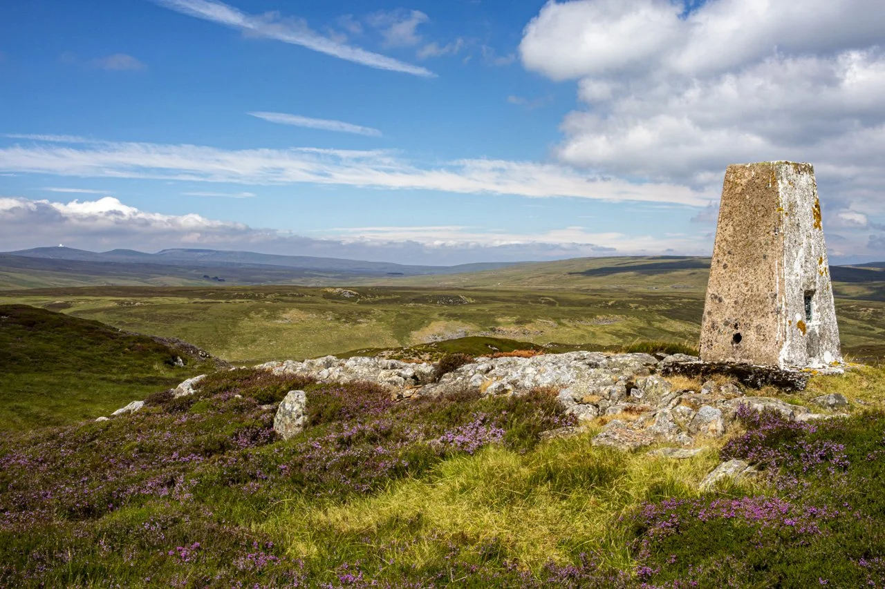 Trig point on summit of Cronkley Fell