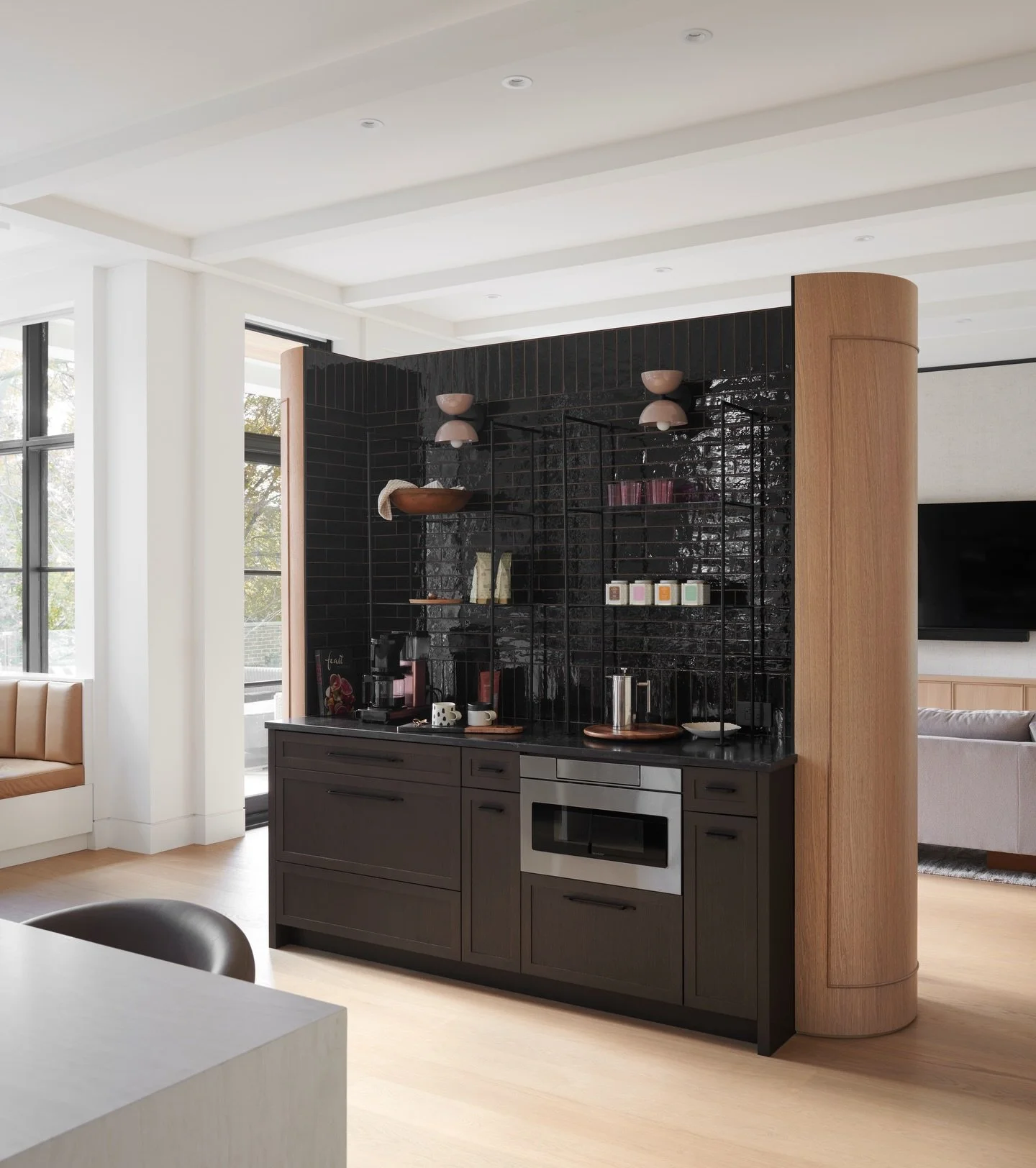 Coffee station but make it beautiful! Love this centre piece designed as a dividing partition between kitchen and family room. We provided dark stained oak millwork to tie in the other moody elements. Designed by @michaelaburnsinteriors 

Photo: @ale