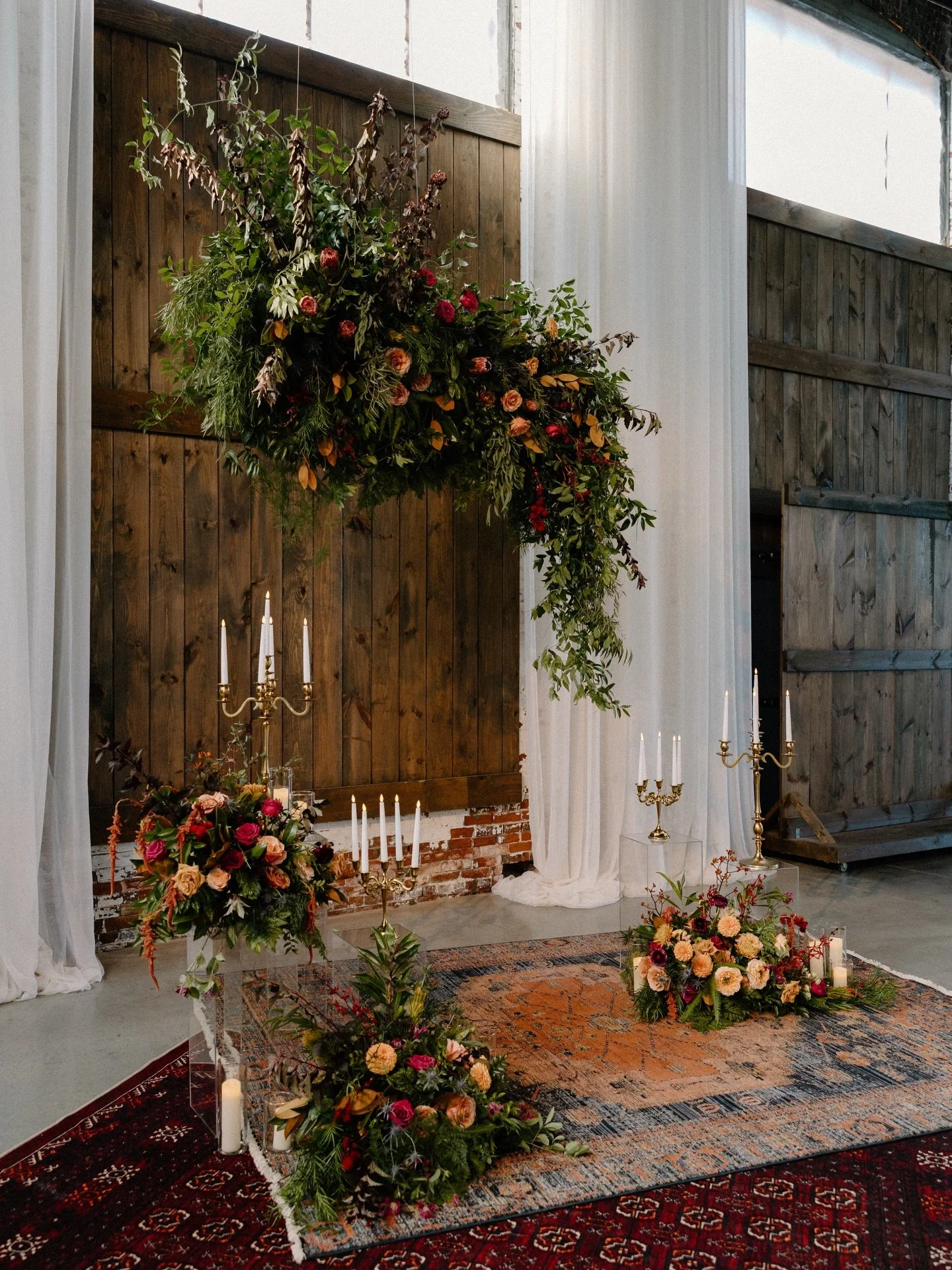 A ceremony space drenched in autumn magic &mdash; warm tones, lush florals, layered textures, and an aisle designed to feel intimate and timeless. We were honored to help bring this romantic vision to life for E &amp; M. 🤍🍂

&bull;

Catering, Plann