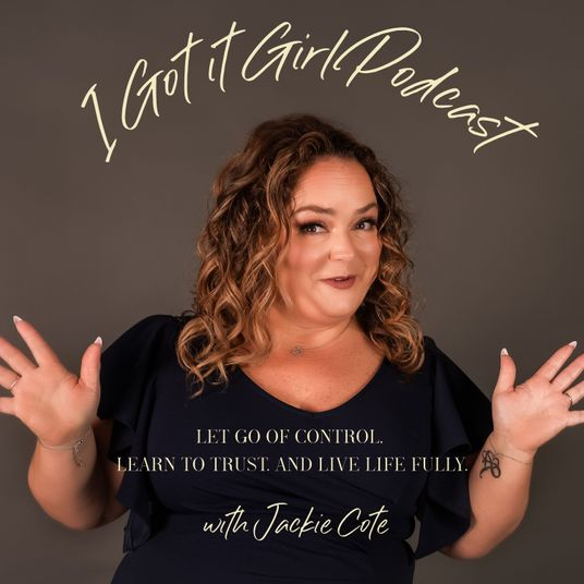 brown background with woman in black shirt with curly hair hands up