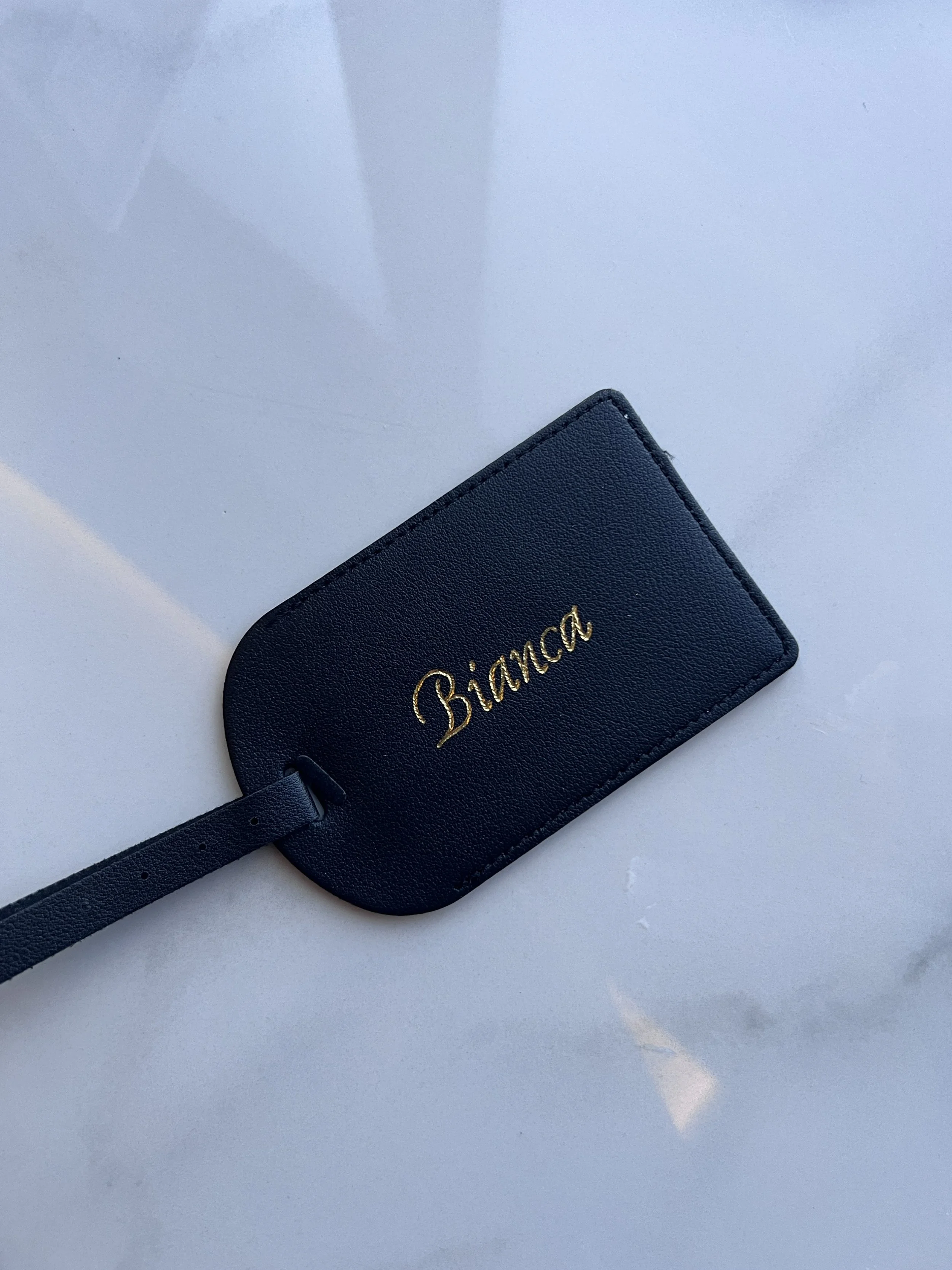 How Live Hot Foil Calligraphy Turns Passport Holders, Luggage Tags &amp; beyond Into VIP Keepsakes for Luxury Brand Activations