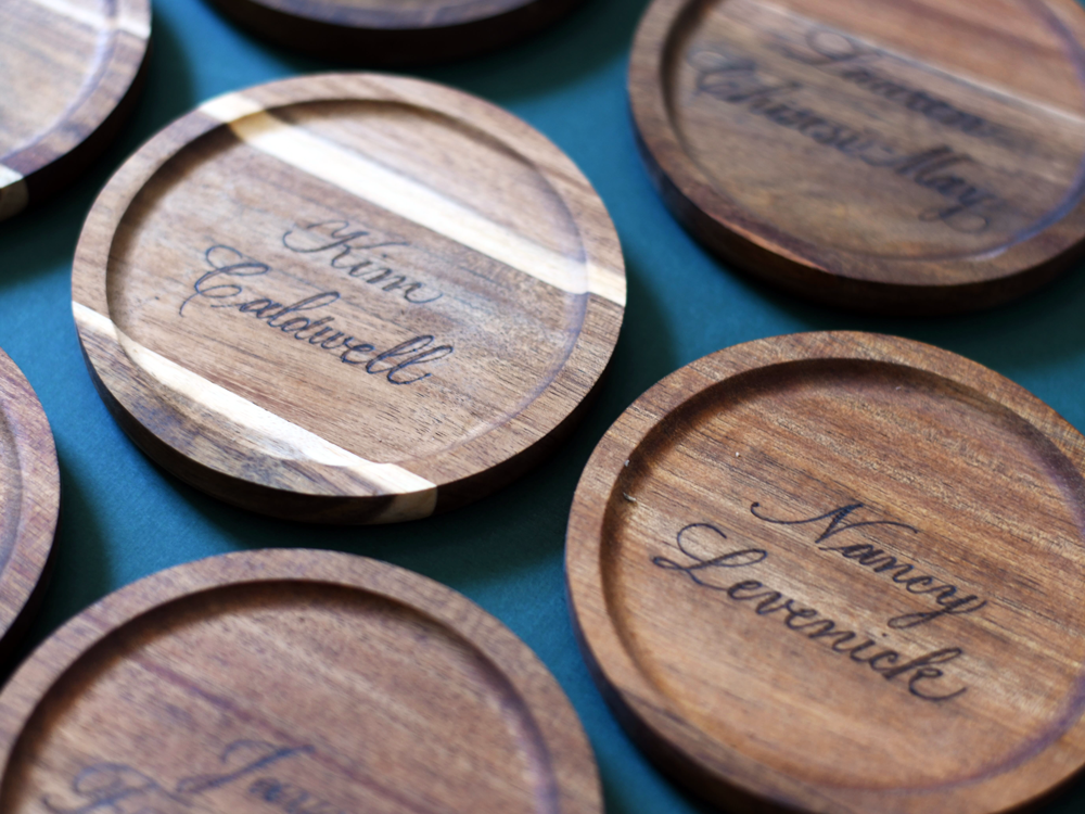 wooden coasters engraved with guest names