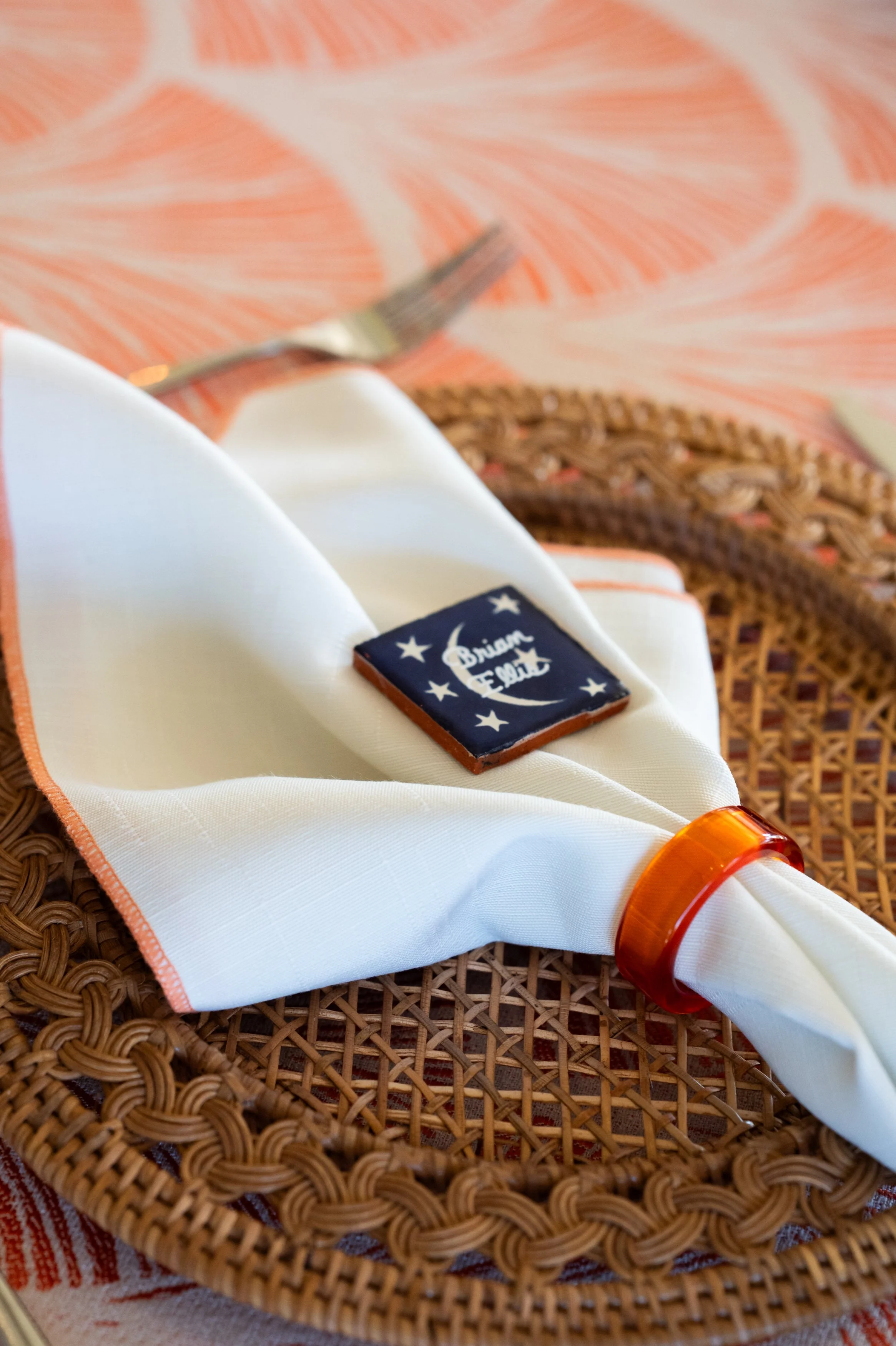 Custom Mexican Azulejo tile place cards with gold hand-lettered calligraphy for a luxury team corporate event