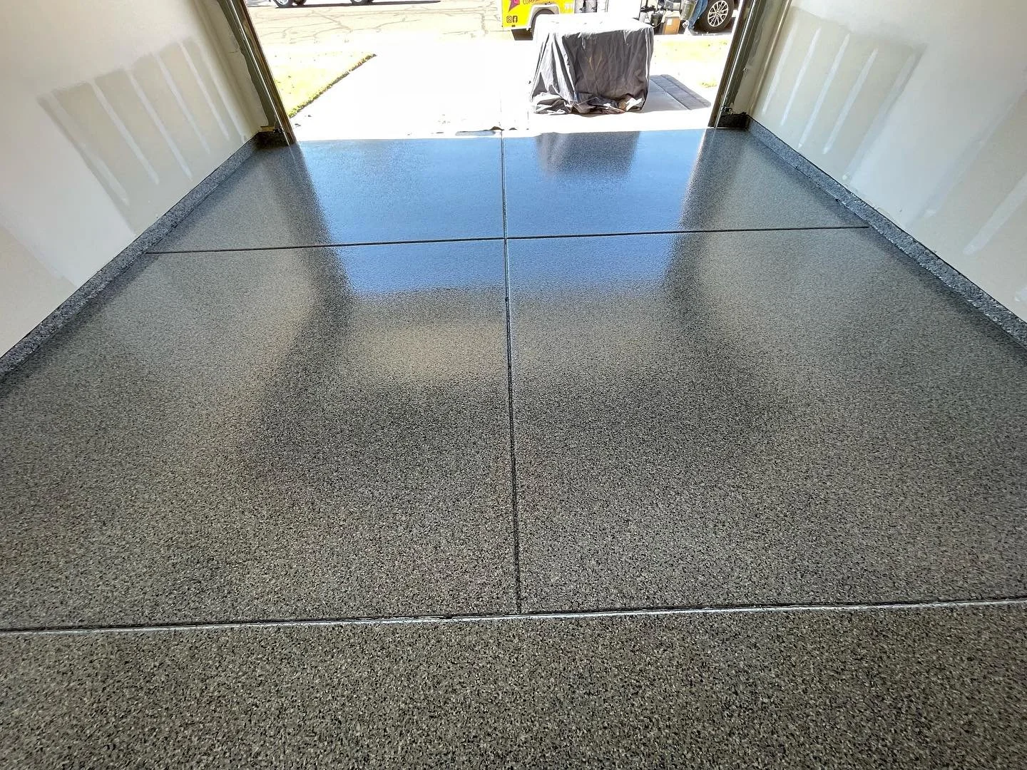 Nightfall Flake Concrete Polyaspartic Coating in Chandler, AZ by The Chip Floor Company.