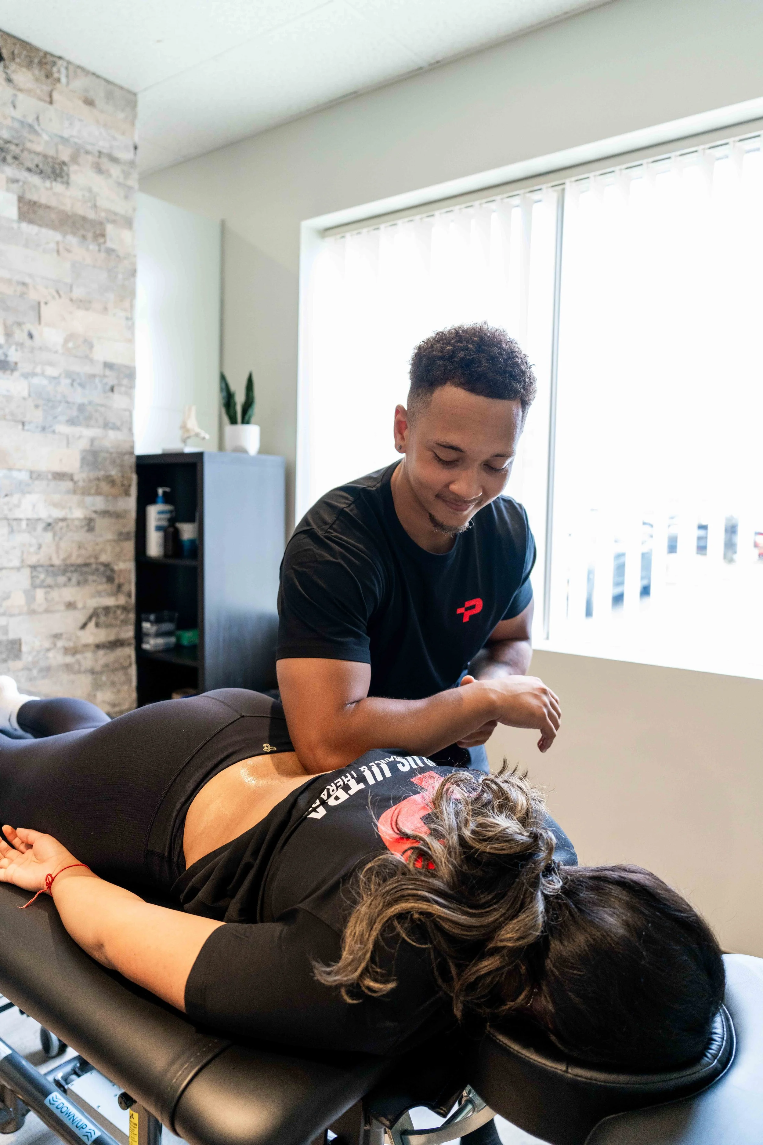 Jacob Scharger, RMT at Plus Ultra Therapy Pickering doing myofascial glide