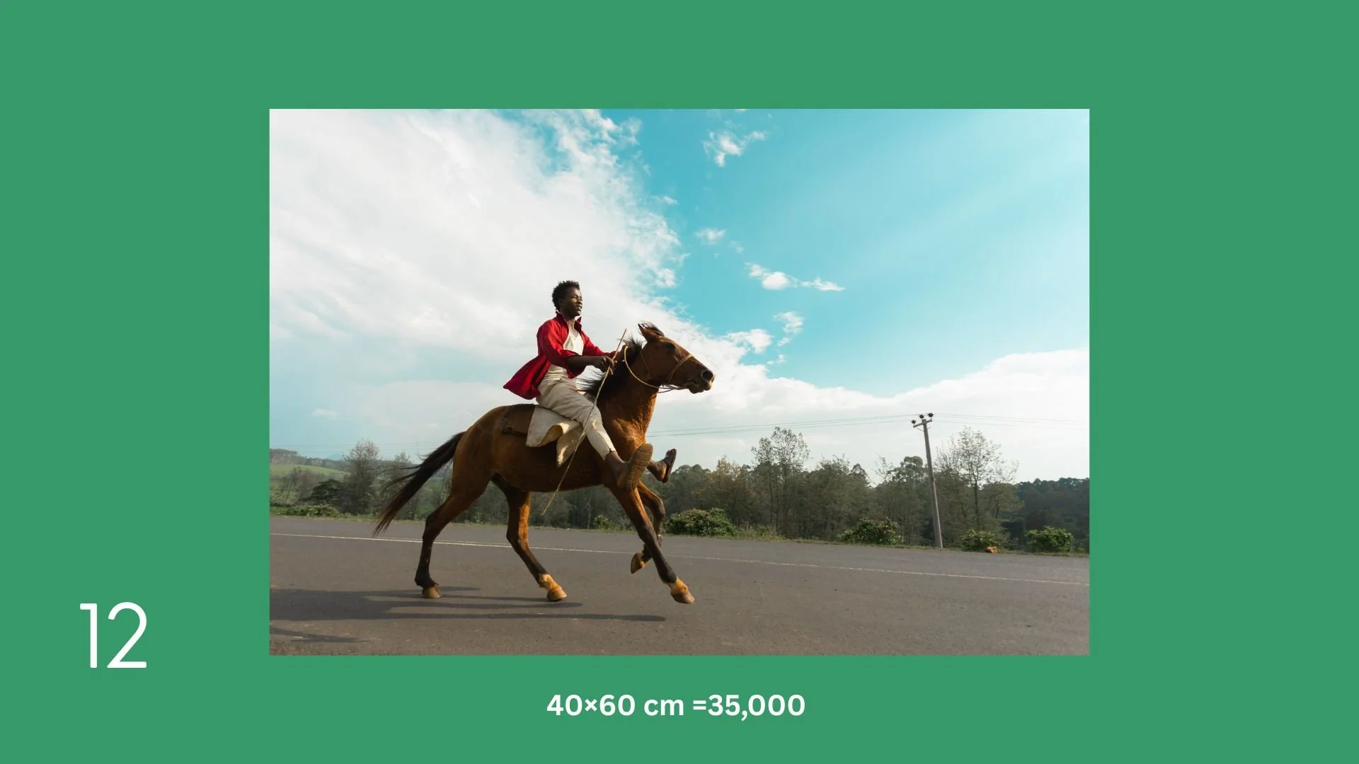 A person riding a galloping brown horse on a paved road with a cloudy sky and trees in the background.
