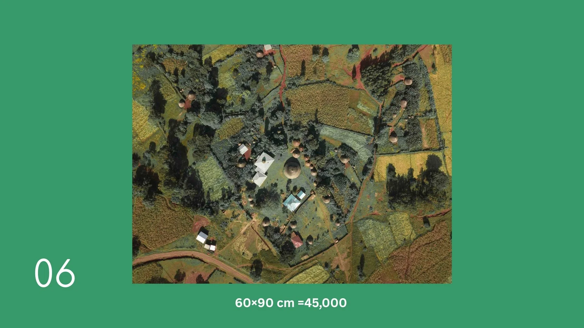 Aerial view of a temple complex with several dome-shaped structures, surrounded by trees and farmland.