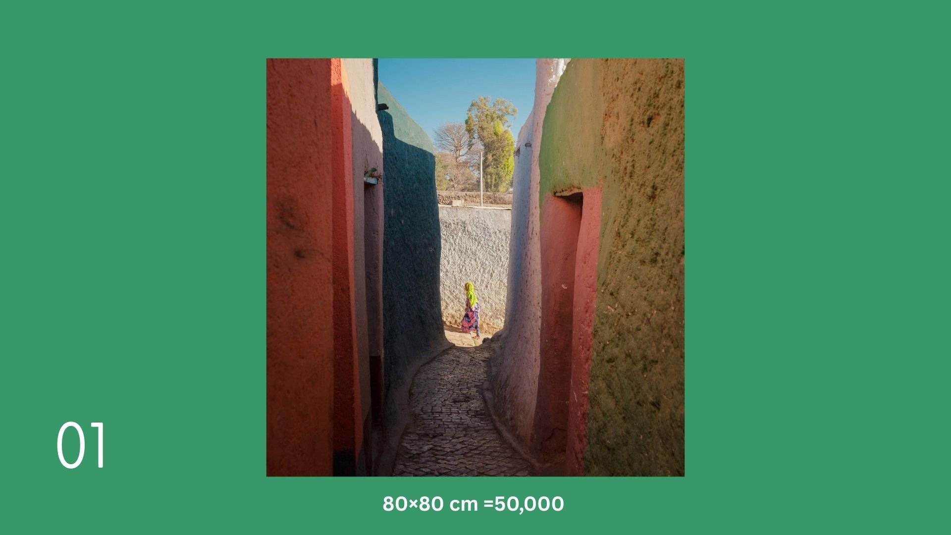 Narrow colorful alleyway with textured walls, a person walking in the distance, trees visible beyond the alley, bright sunny sky.
