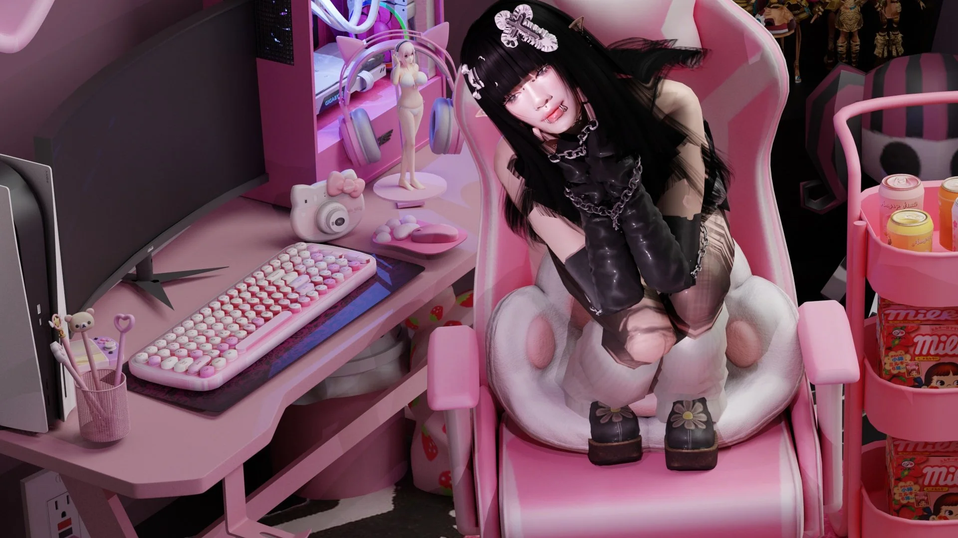 A person with black hair and gothic clothing sitting on a pink armchair in front of a pink desk with computer and decorative items, including a figurine and headphones.