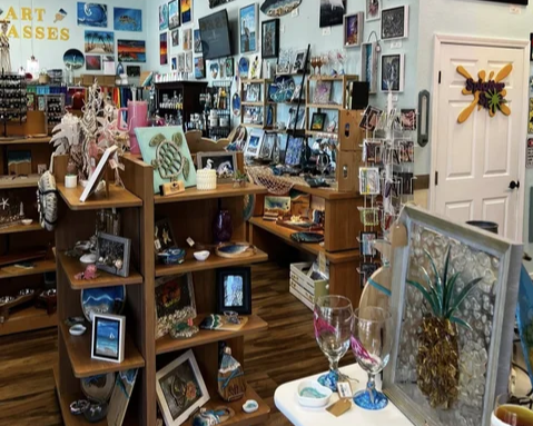 Art studio interior with paintings, handmade gifts, and art class supplies on display