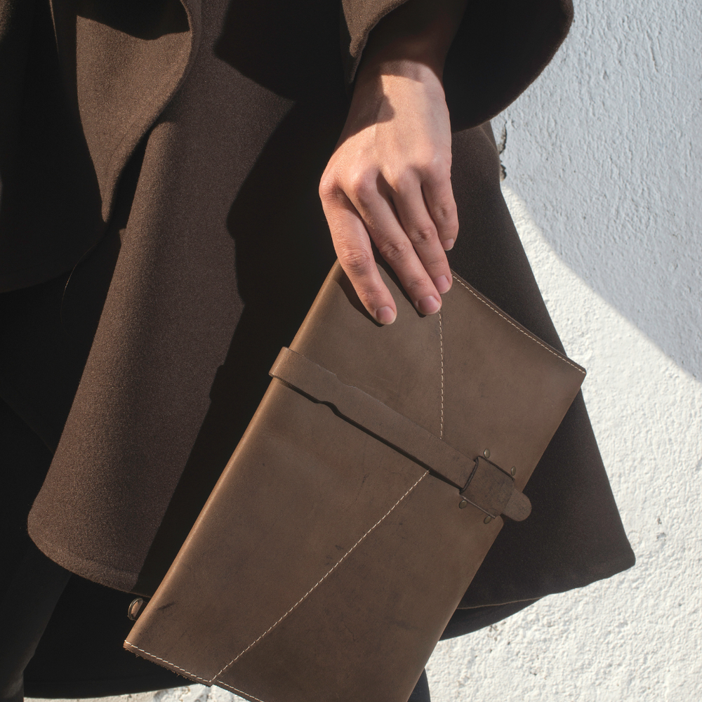 Leather pochette, a guest gift designed for a luxury hotel