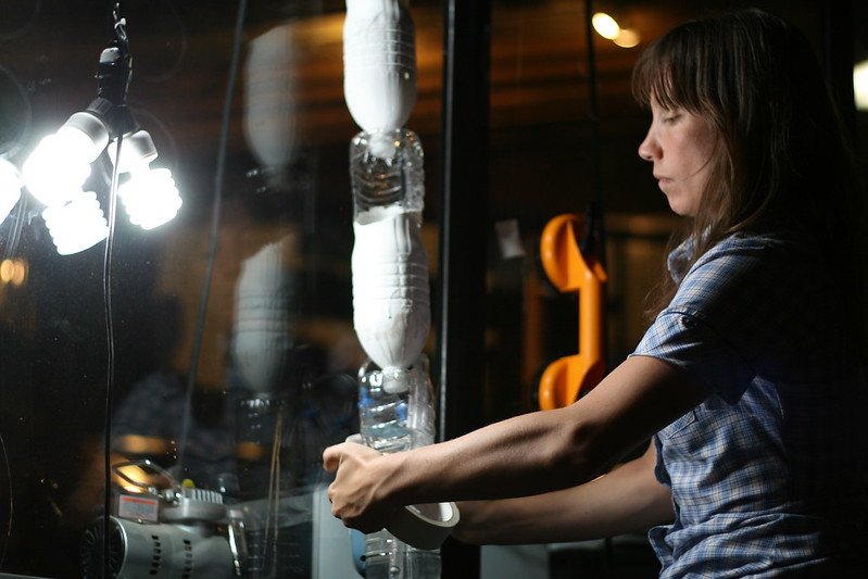 @Brittariley installs the American Public Windowfarm, a waterbottle windowfarm, via suction cups on the enormous windows at the Whitney Museum of American Art Photo credit: Ted Ullrich