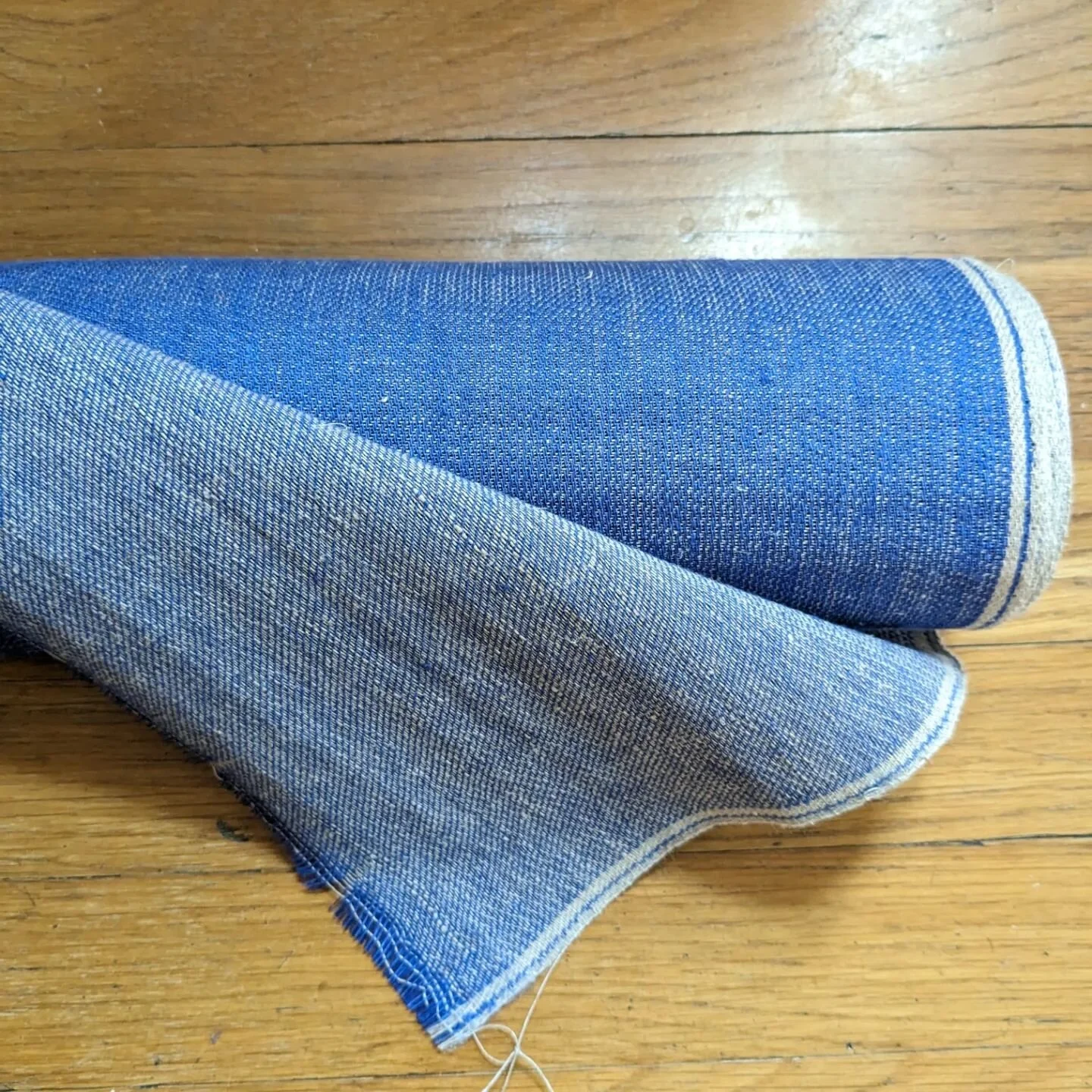 Weaving under a deadline means things come off the loom that much quicker. This thicker linen denim wove up faster than my last warp, since I got about 36 picks per inch, as opposed to ~60.

Now to darn and wash then finally meet the finished cloth. 
