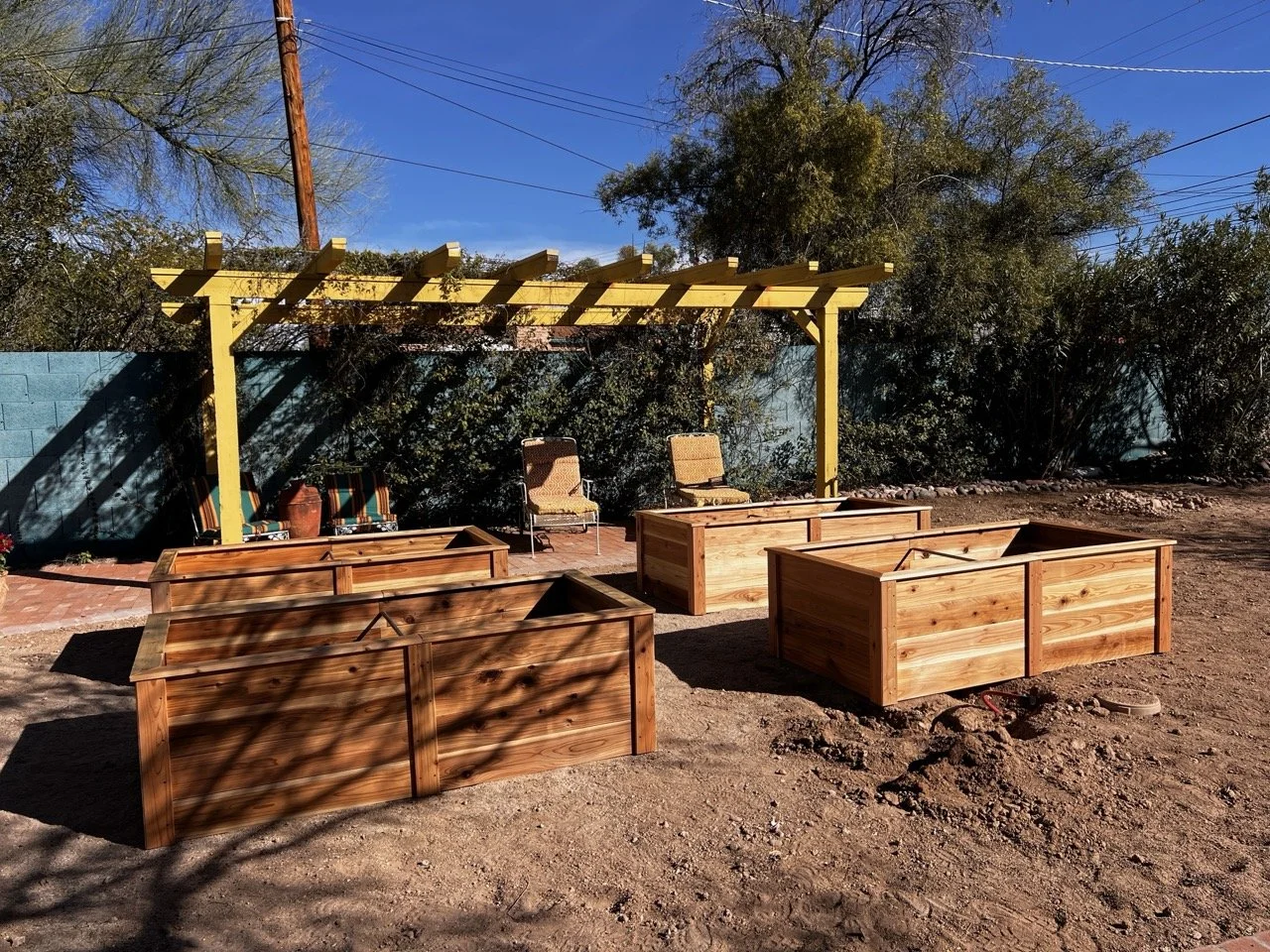 The wooden raised beds need a stain safe for vegetable gardening.