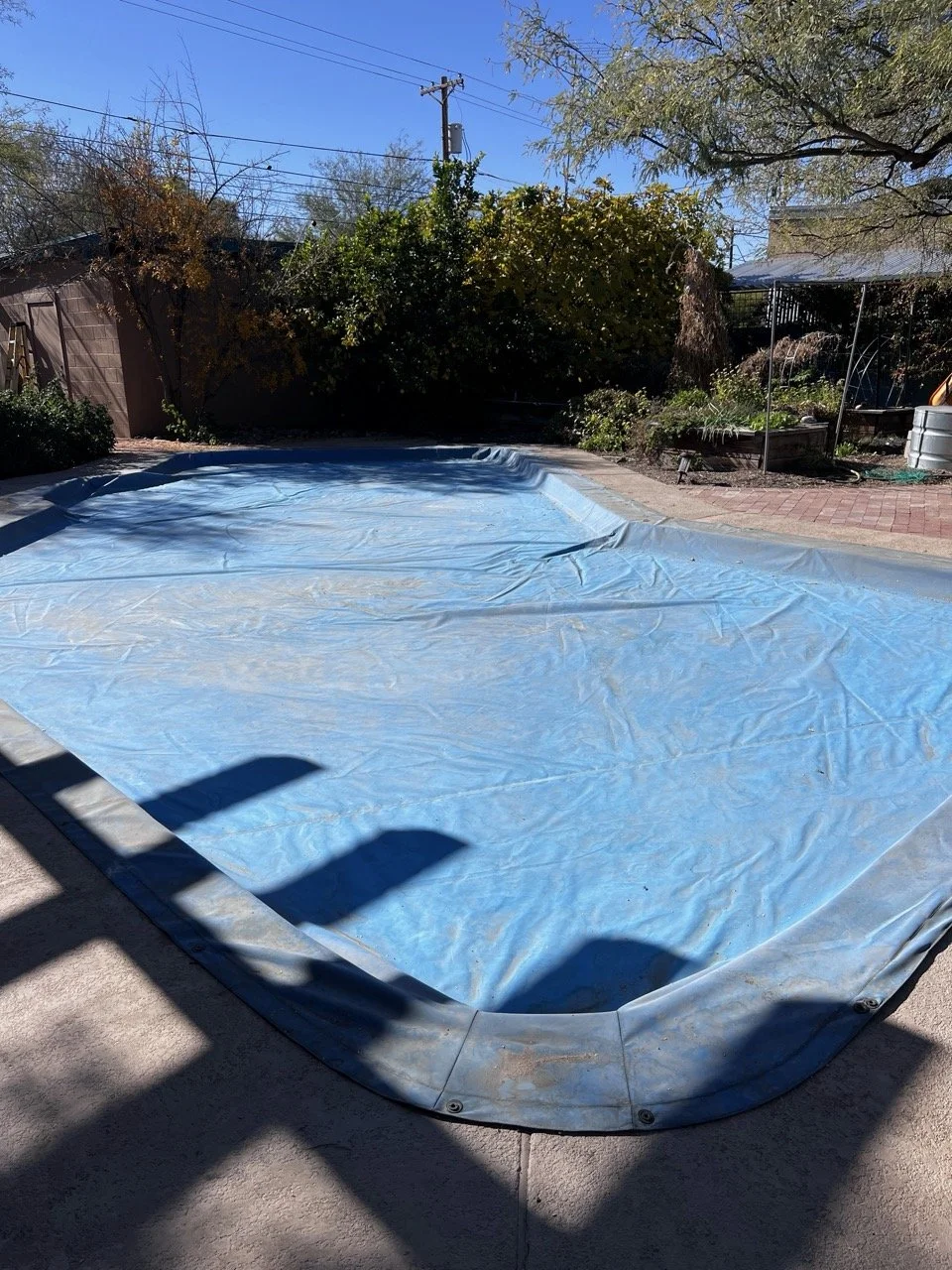 Usually covered to reduce maintenance and evaporation, this pool was never used. 