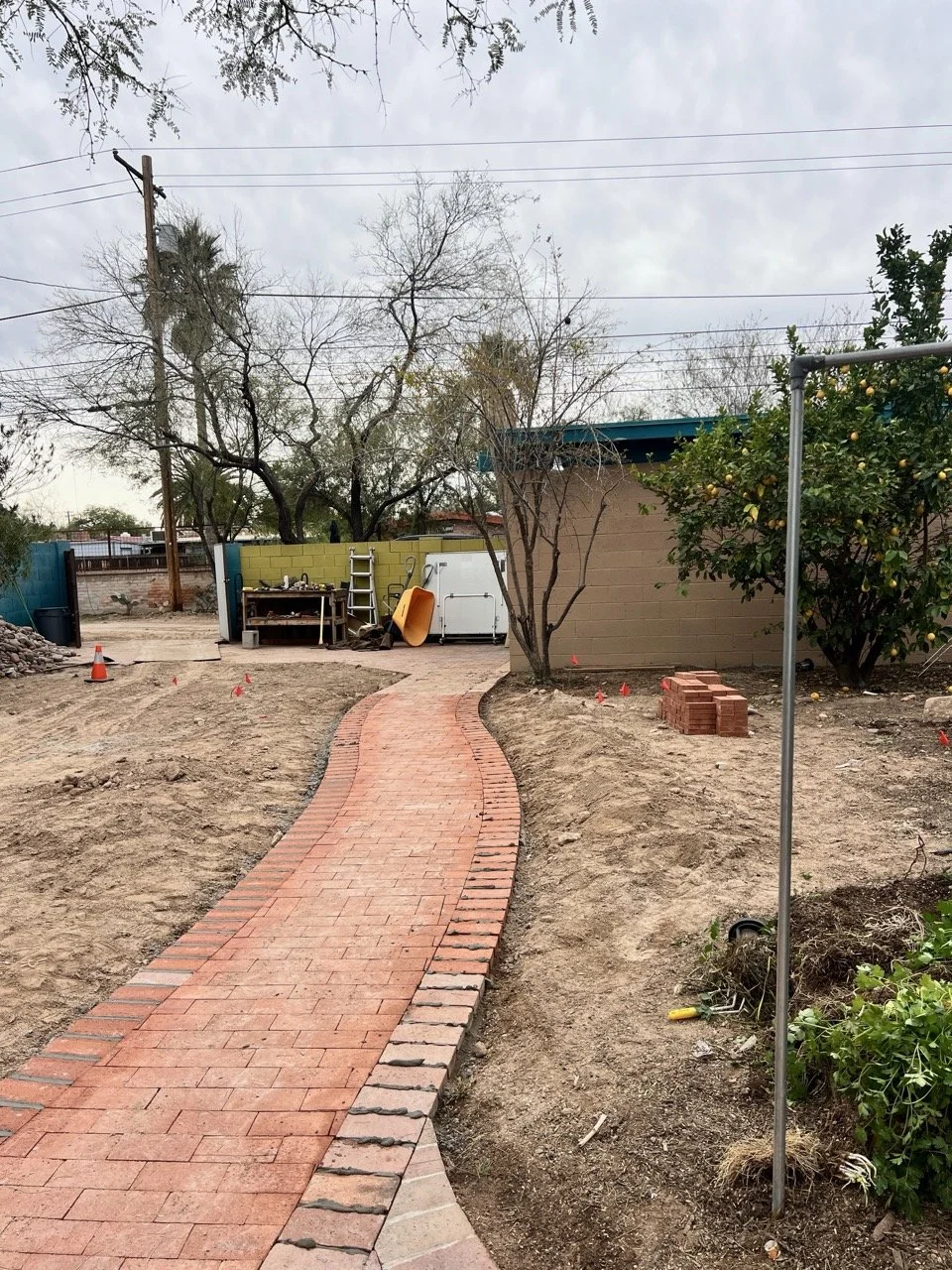 A brick pathway connects the garage to the home for ease of travel and also carting groceries in a little wagon.