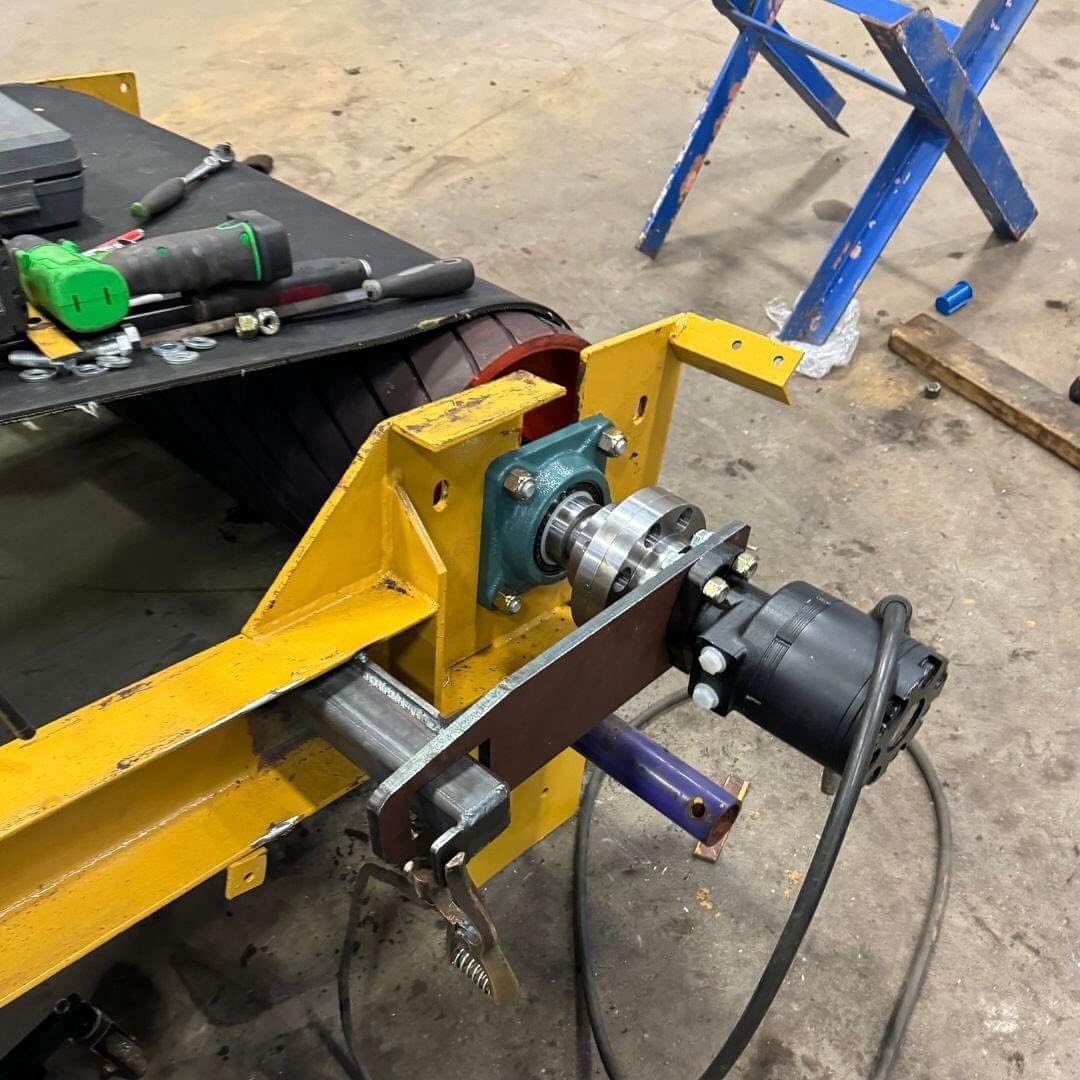 PROBLEM - Customer needed an out of service conveyor converted from electric to hydraulic power

SOLUTION - New Head Pulley Assembly, coupler and drive motor, utilizing parts that cross over to his screening plants
 
#materialhandling #aggregate #qua