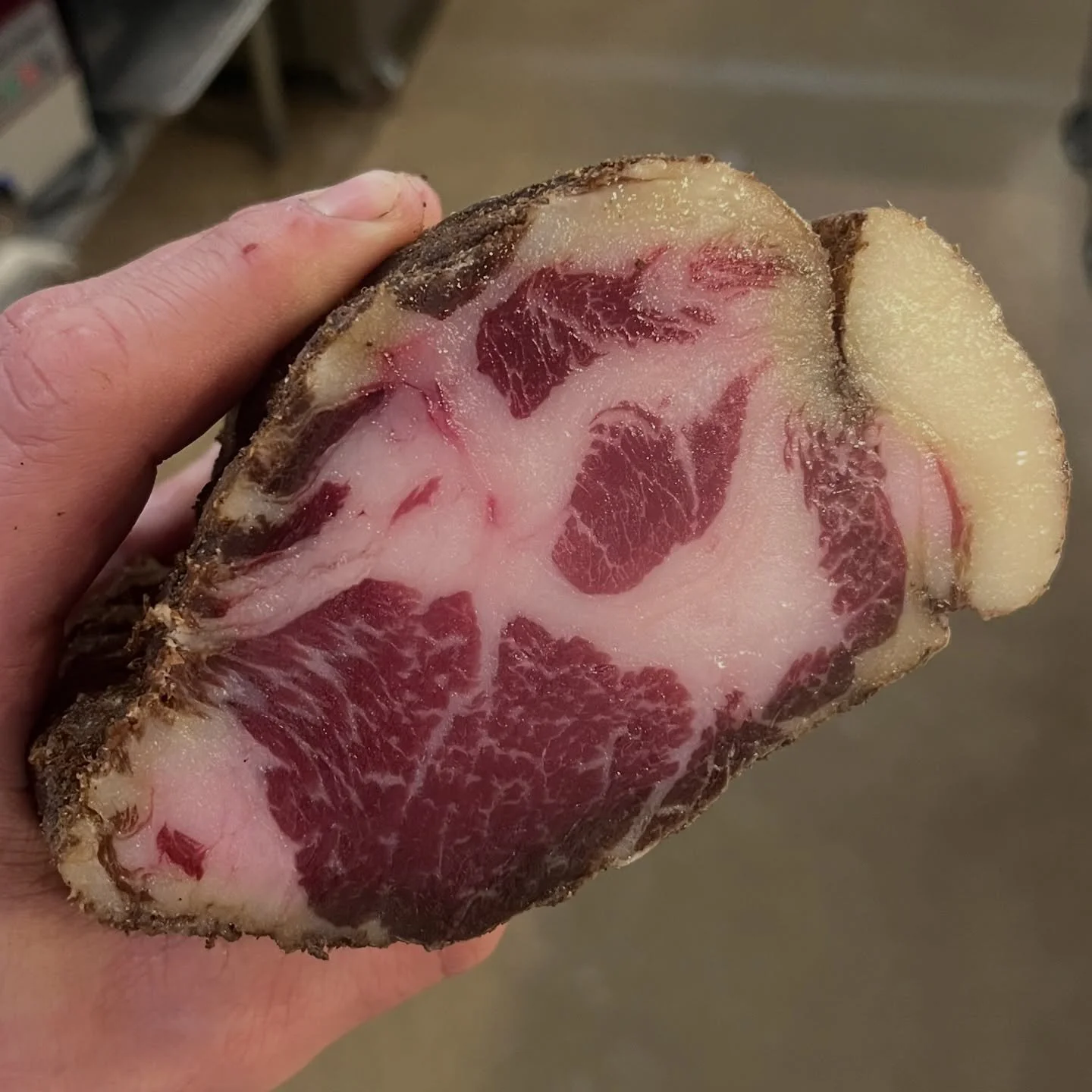 This sexy pork neck has been hanging out for around 6 months.  We cracked it open today for a customer @carnistkelowna .  It straight up melts in your mouth 🤘🏼 We cured this Coppa with @martinslanewinery Riesling grape must.  Very beautiful 🤌🏽
@b