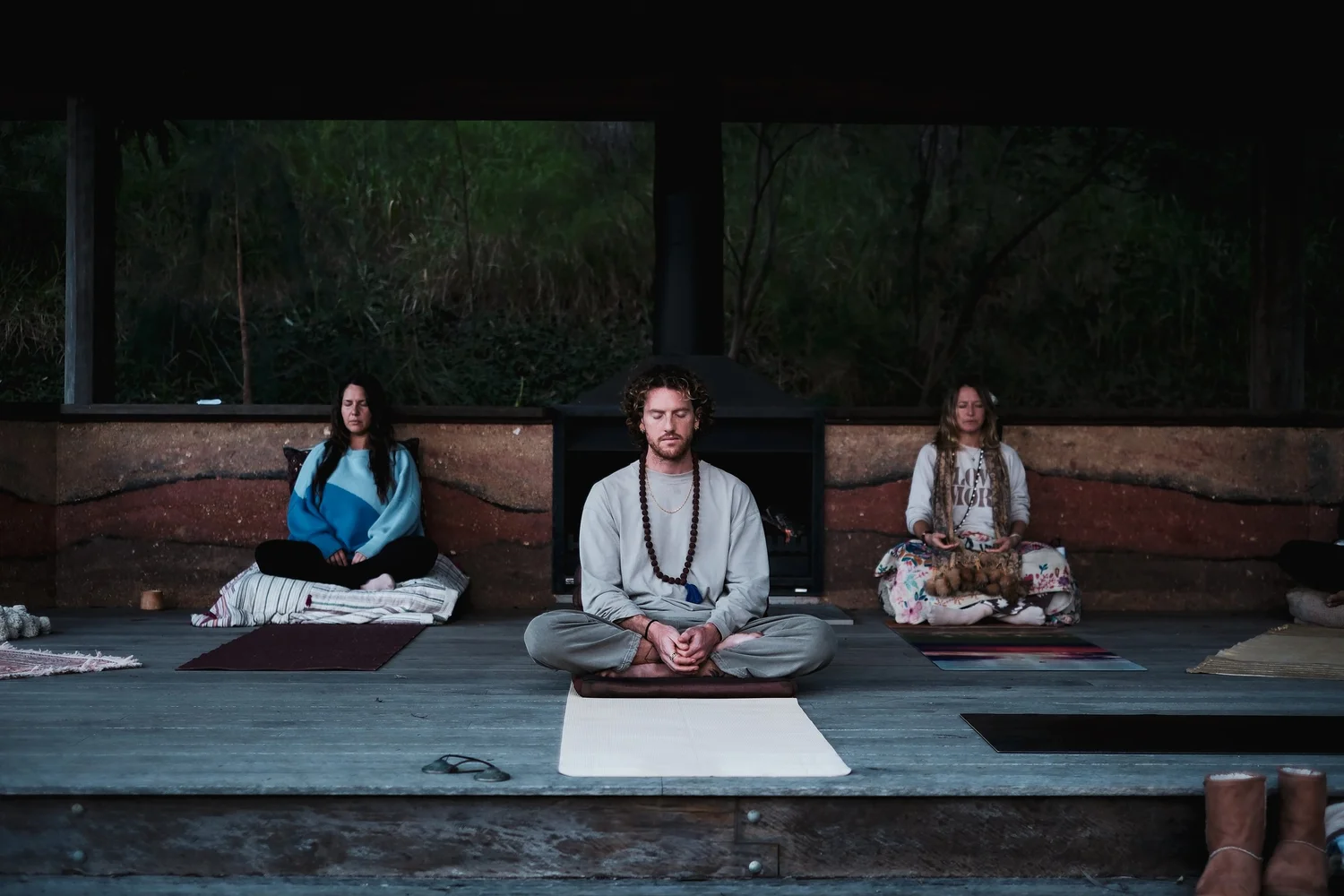 Mike meditating with students on the deck
