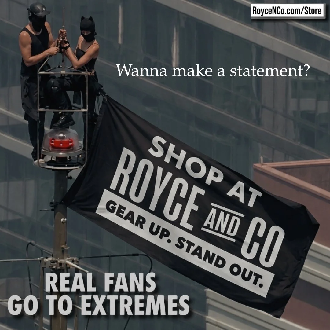 Two workers wearing black masks and helmets are on a lift installing a black flag that reads 'Shop at Royce and Co, Gear up, stand out.' Next to the flag, there is text that says 'Wanna make a statement?' and at the bottom, 'Real fans go to extremes'.