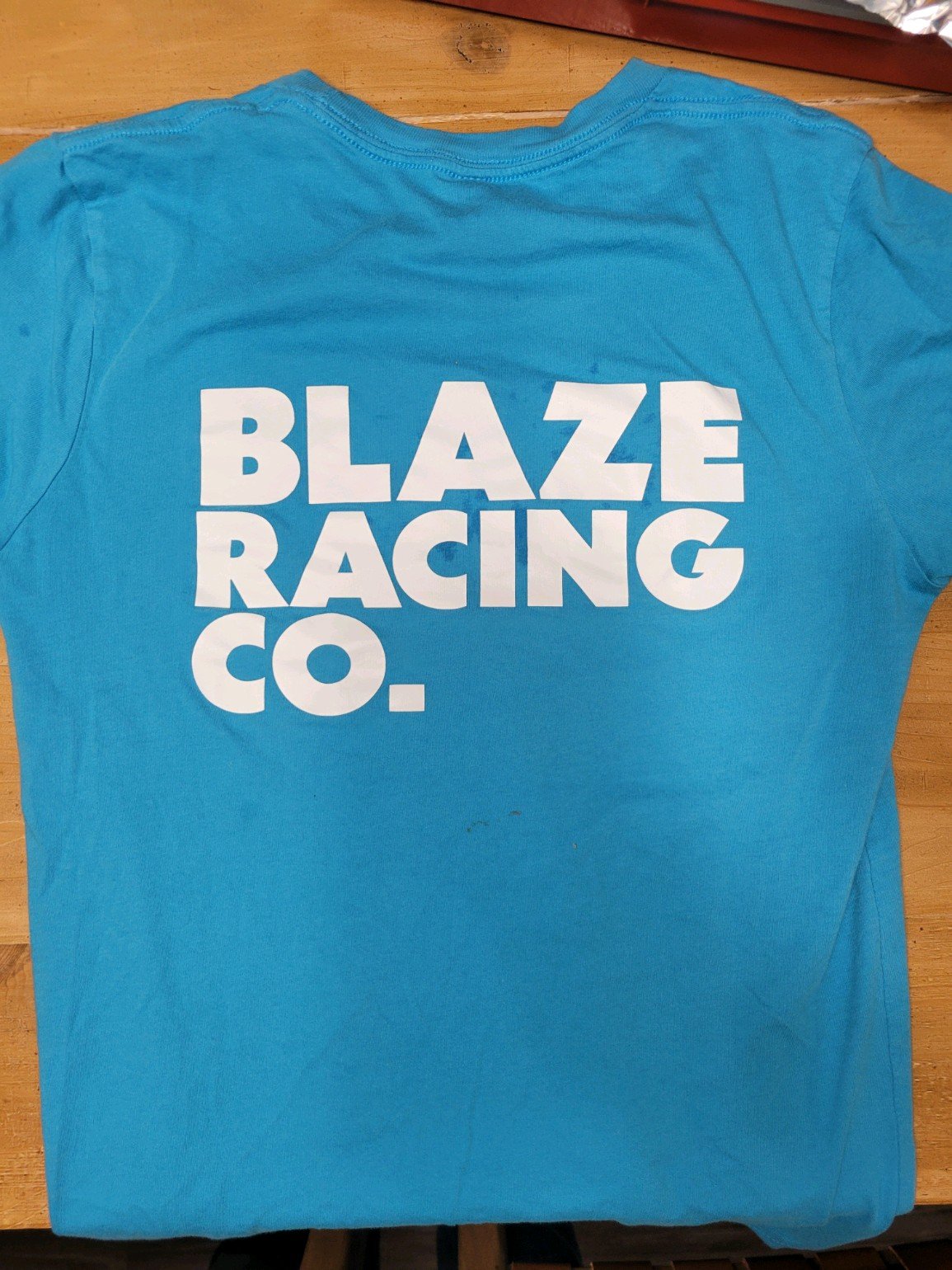 Blue t-shirt with large Blaze Racing Co. on back